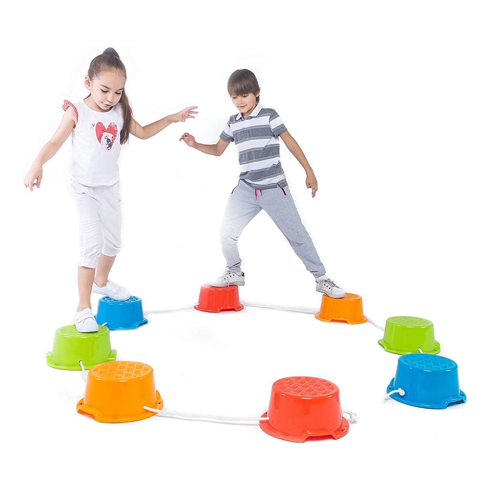 Two children playing with colorful stepping stones on a white background