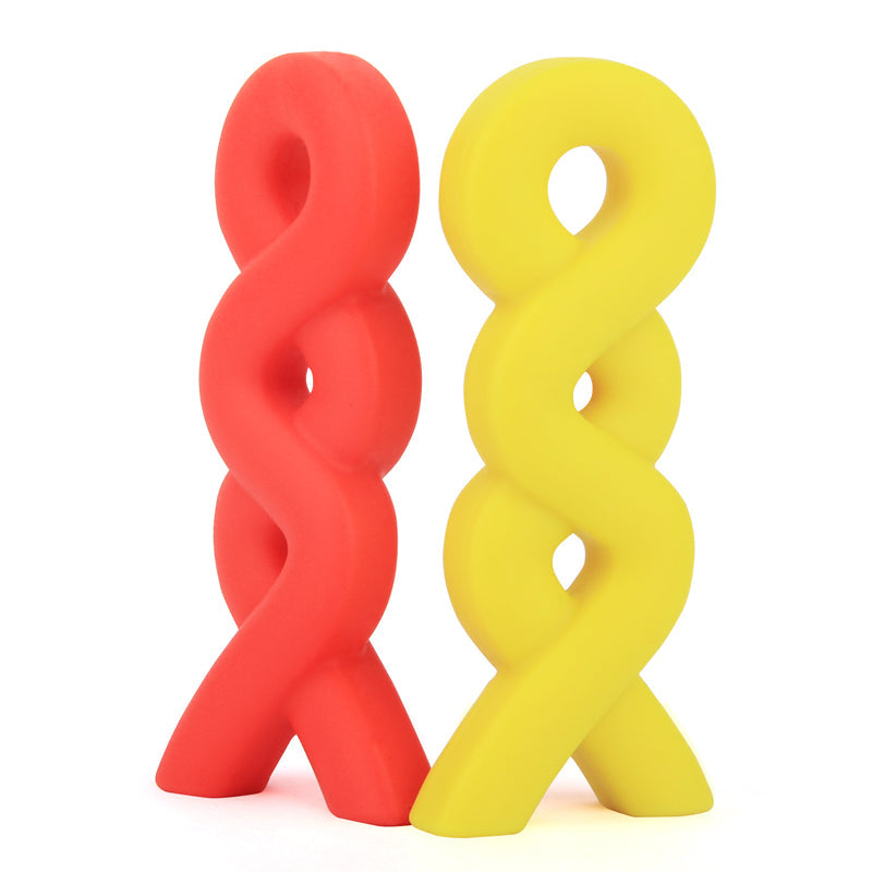 Red and yellow twisted plastic objects on a white background