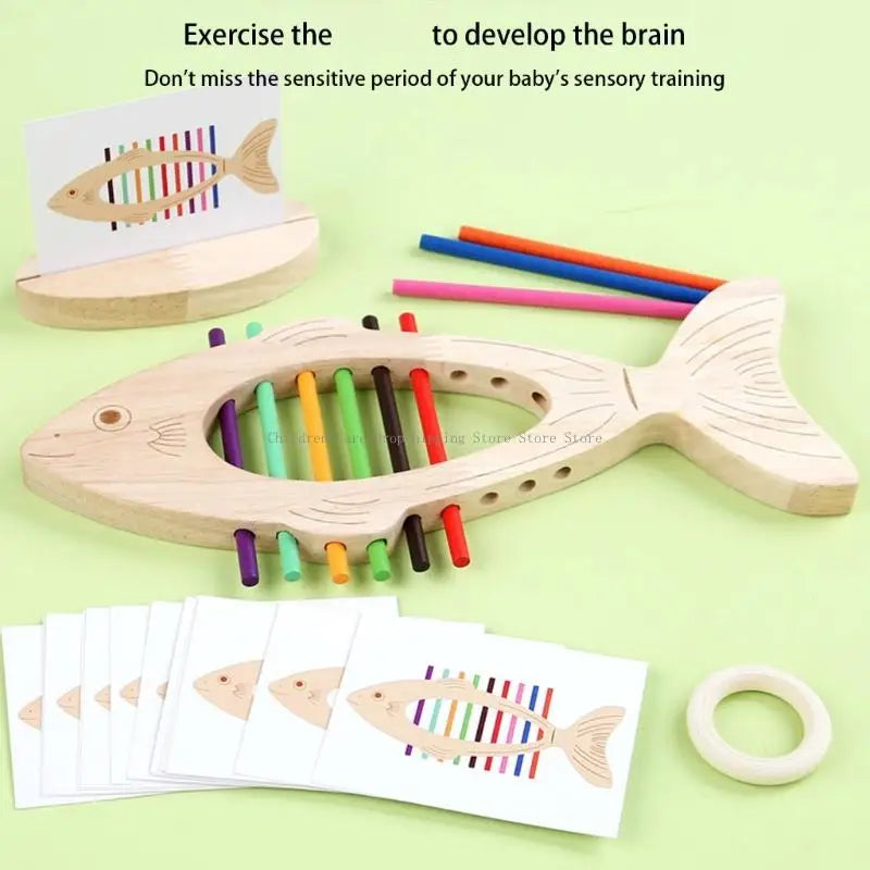 Wooden fish-shaped educational toy with colorful sticks on a light green background