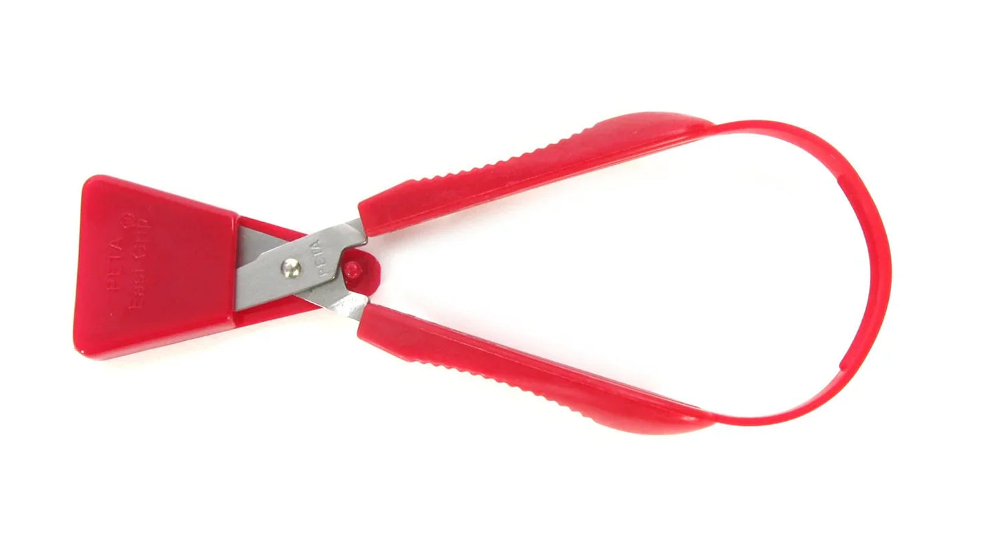 Red ergonomic easy-grip scissors with adaptive handle for special needs, white background