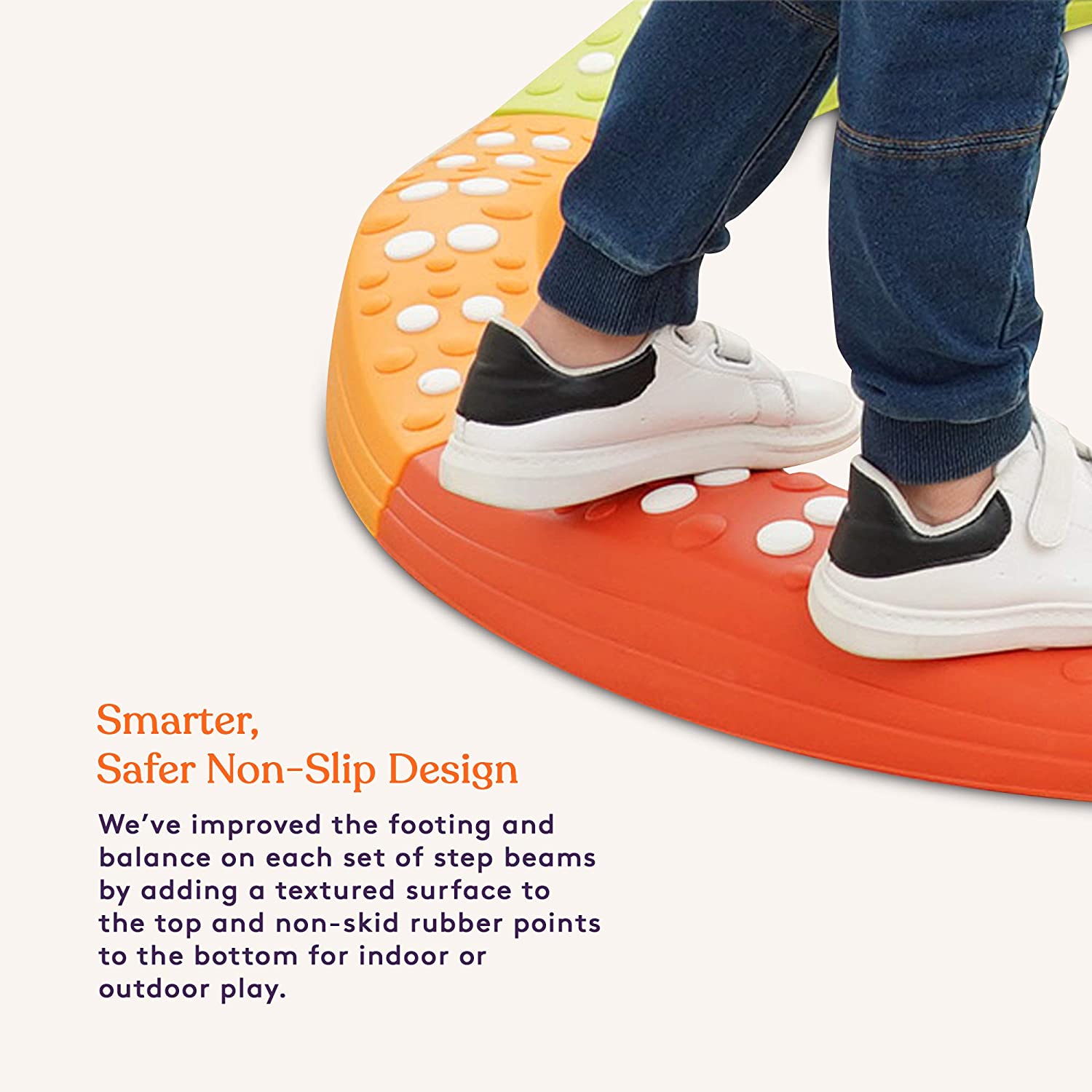 Children's feet on a textured step beam with text about improved non-slip design.