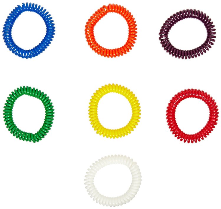 Set of colorful coiled hair ties on a white background