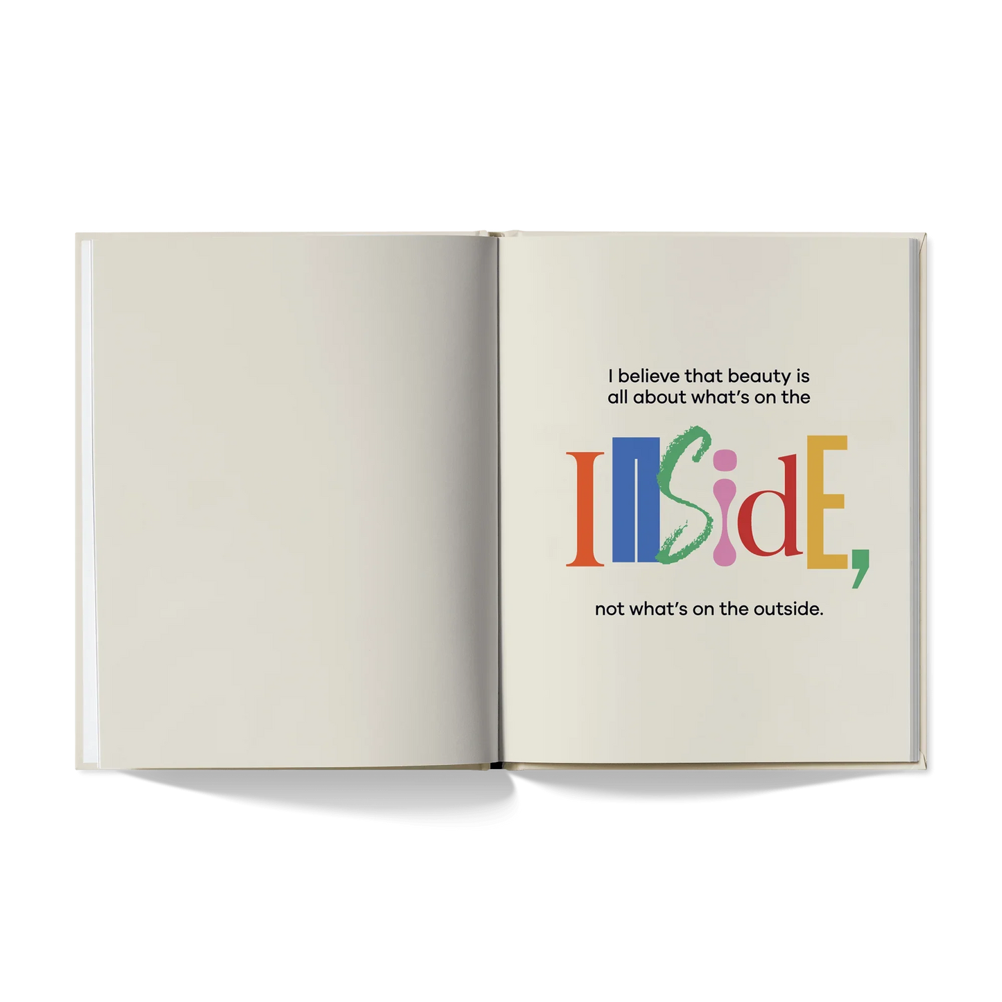 Open book with colorful quote, 'I believe that beauty is all about what’s on the inside'.
