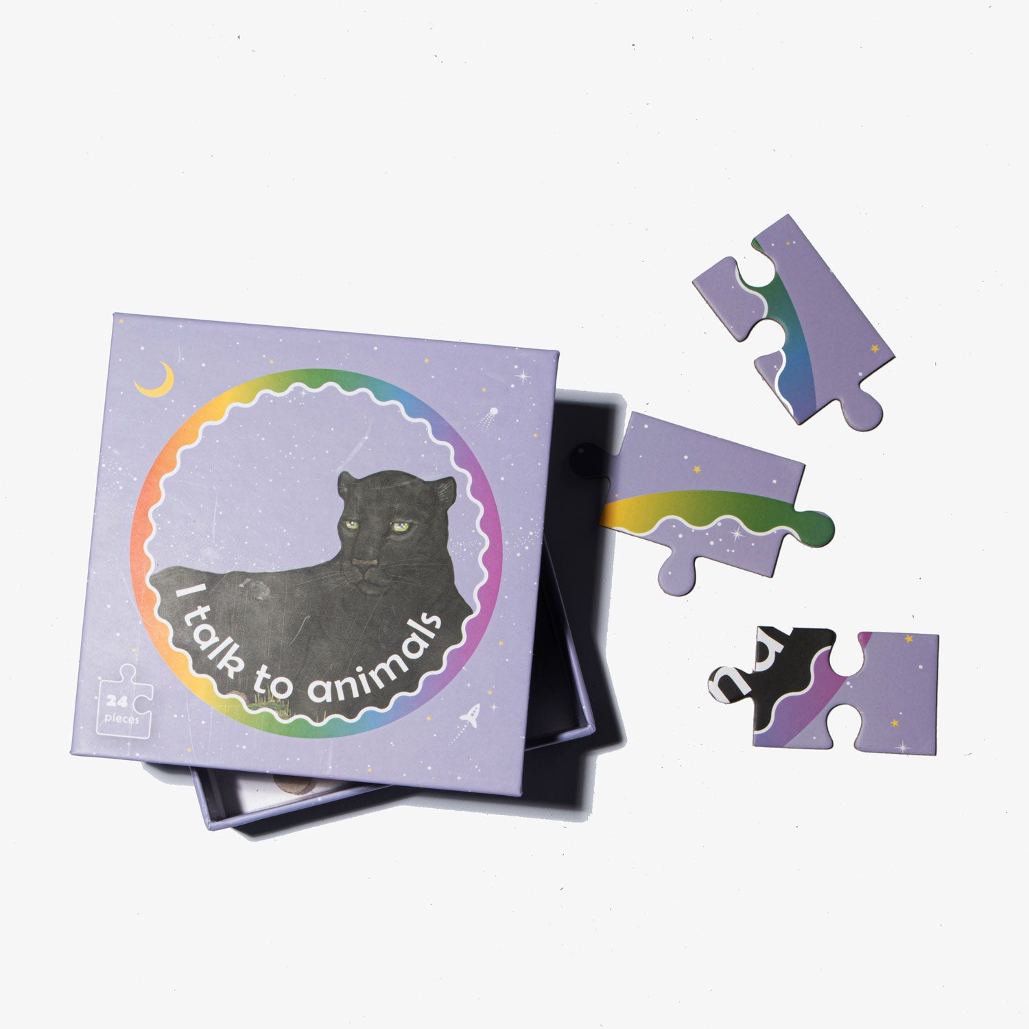 Jigsaw puzzle with a purple box featuring a black panther illustration and 'I talk to animals' text on a white background.