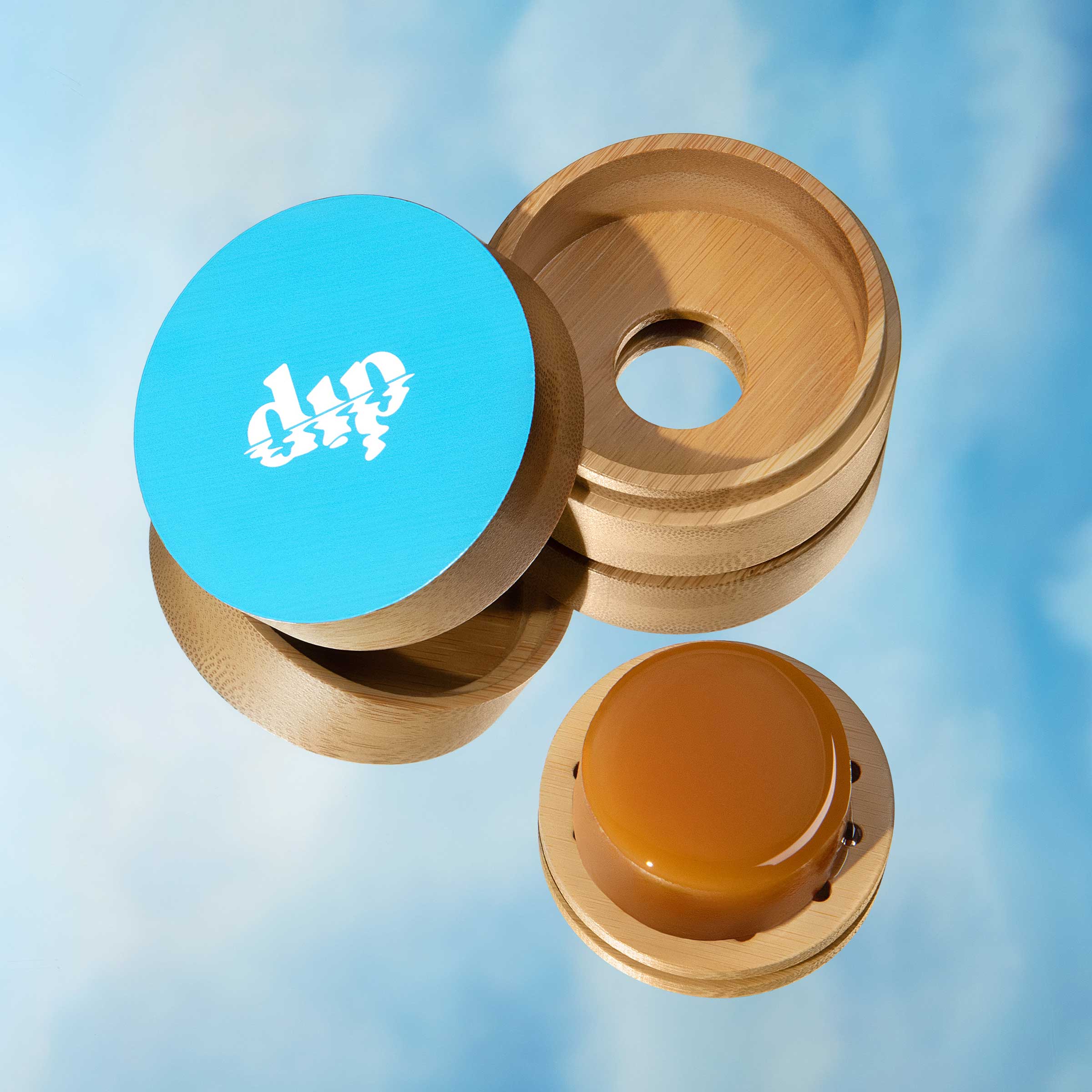 Wooden fidget spinner with blue top and brown bottom on a light blue background