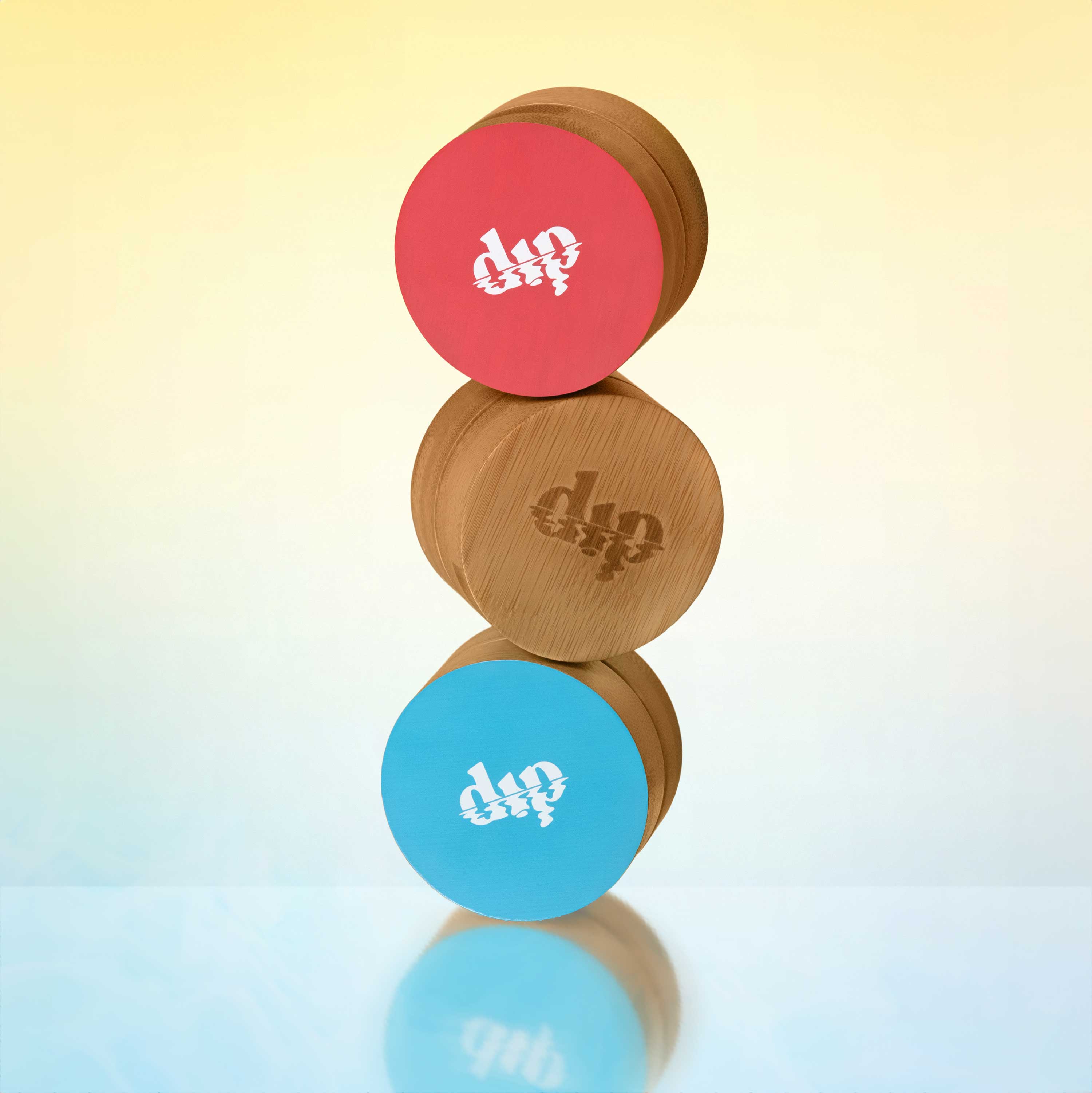 Stack of three circular wooden blocks with 'dip' branding on a gradient background