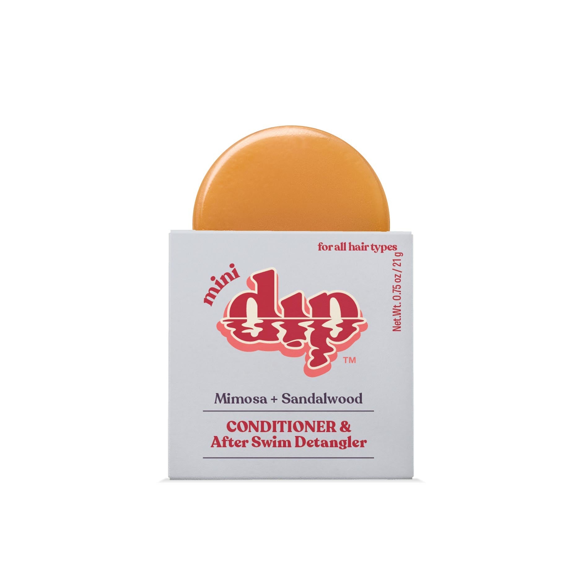 Bar of soap with a white box labeled 'mini dip' on a white background