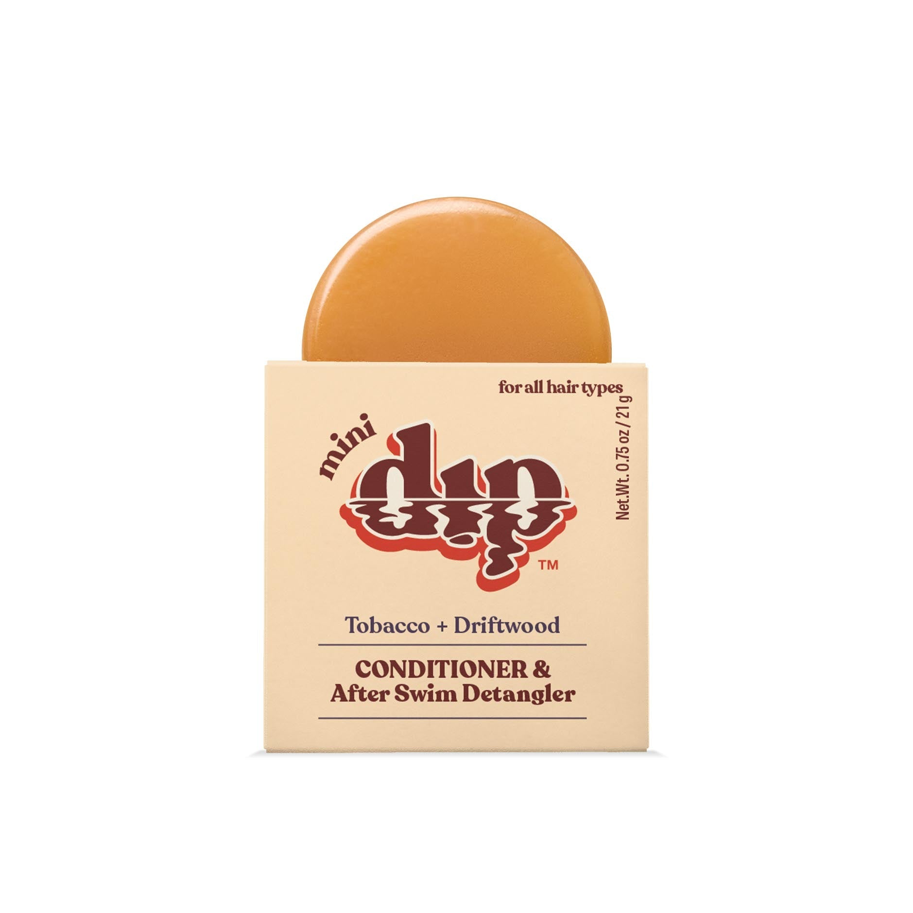 Bar of soap with packaging labeled 'mini dip' on a white background