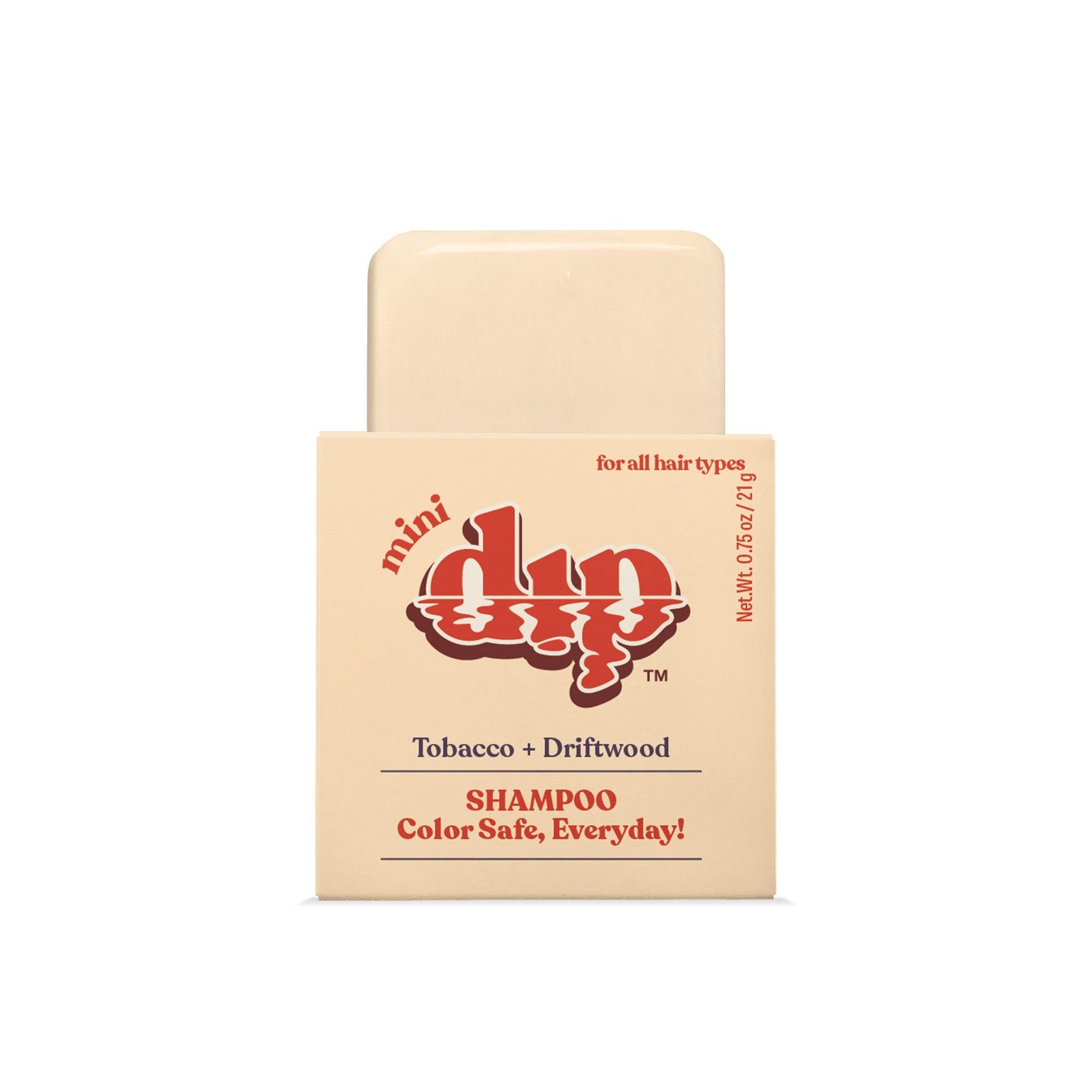 Shampoo bar with packaging labeled 'mini dip' on a white background