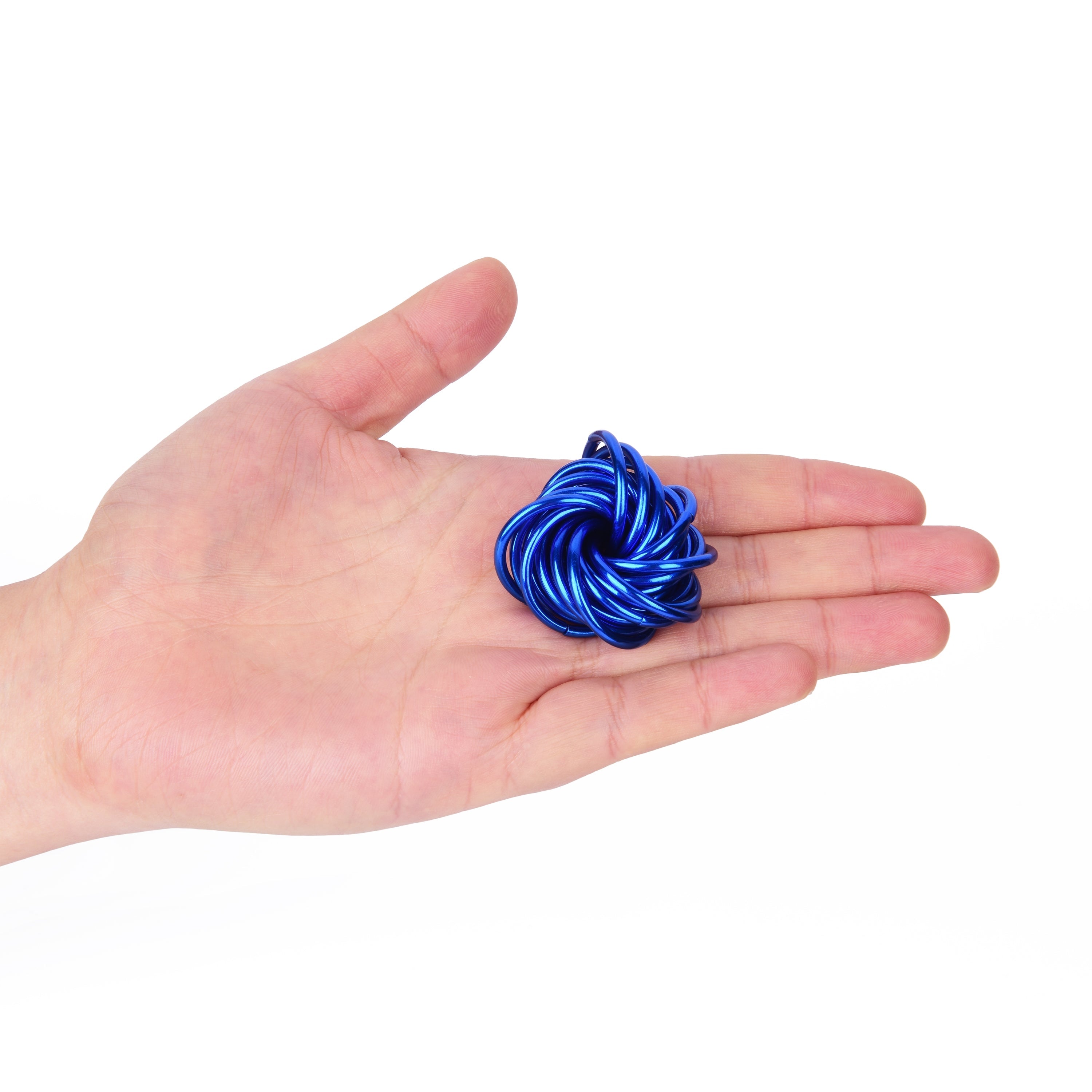 Blue metal knot held in a hand on a white background
