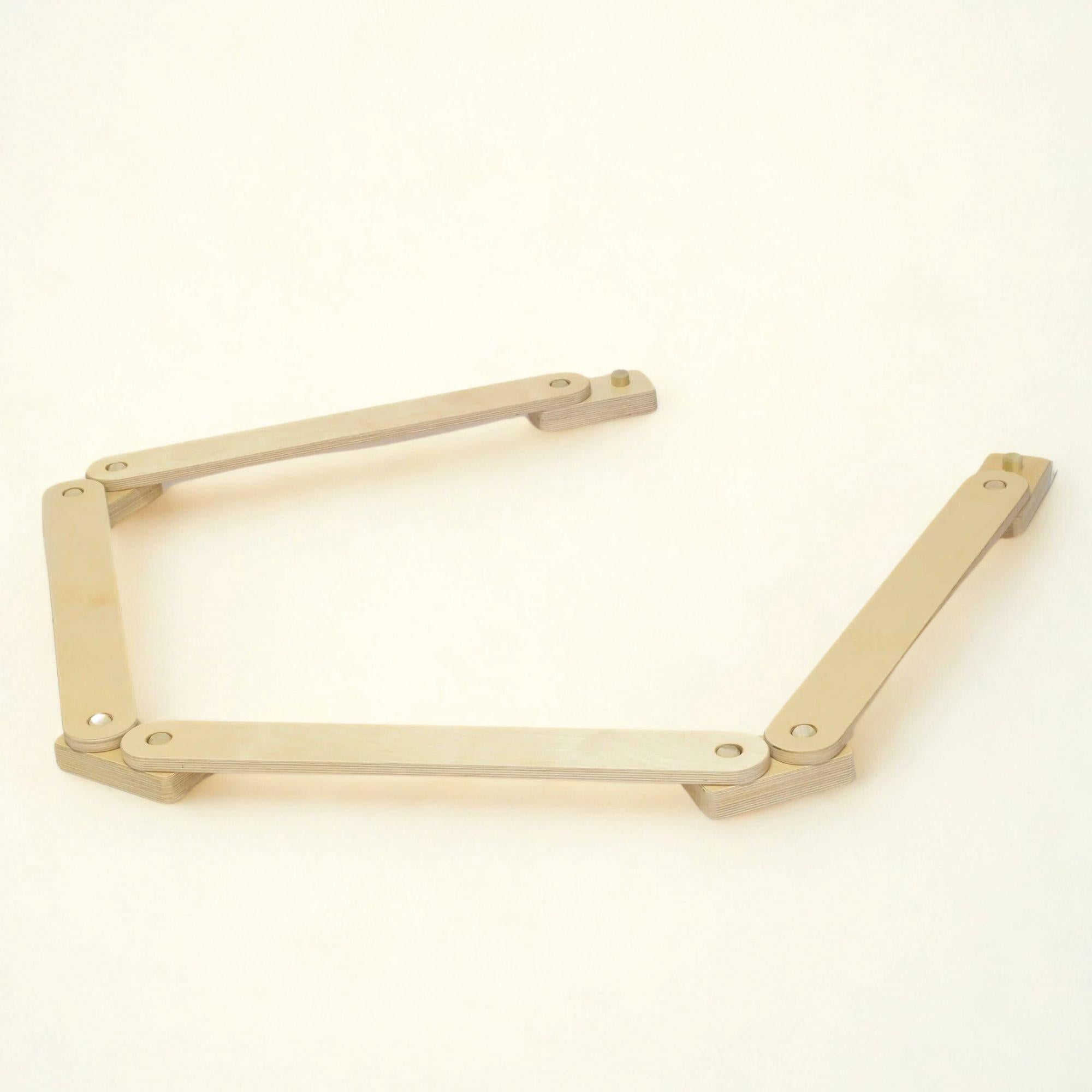 Gold metal bracket on a white background