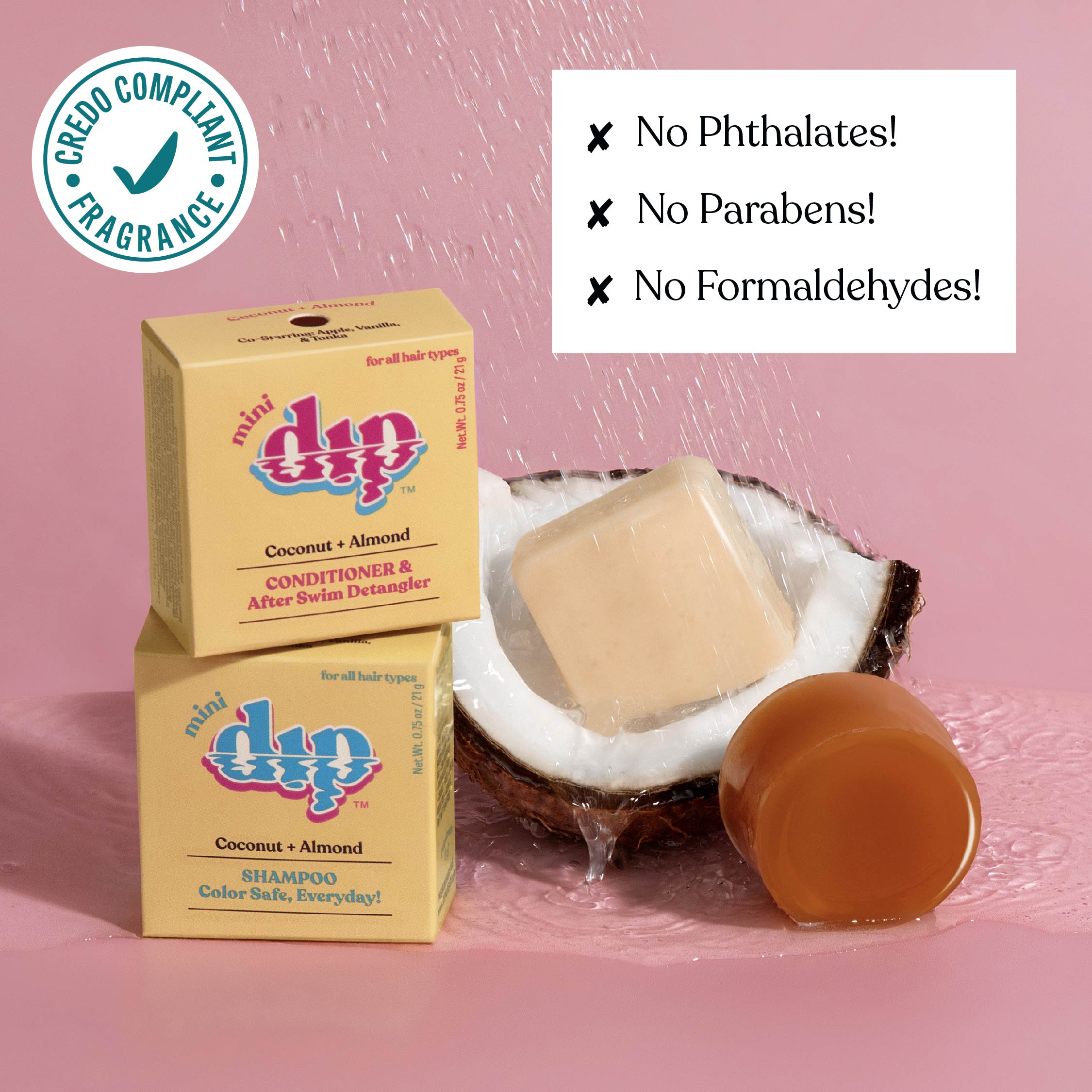 Dip shampoo and conditioner bars with coconut and almond scent on a pink background, featuring greenery and flowers.