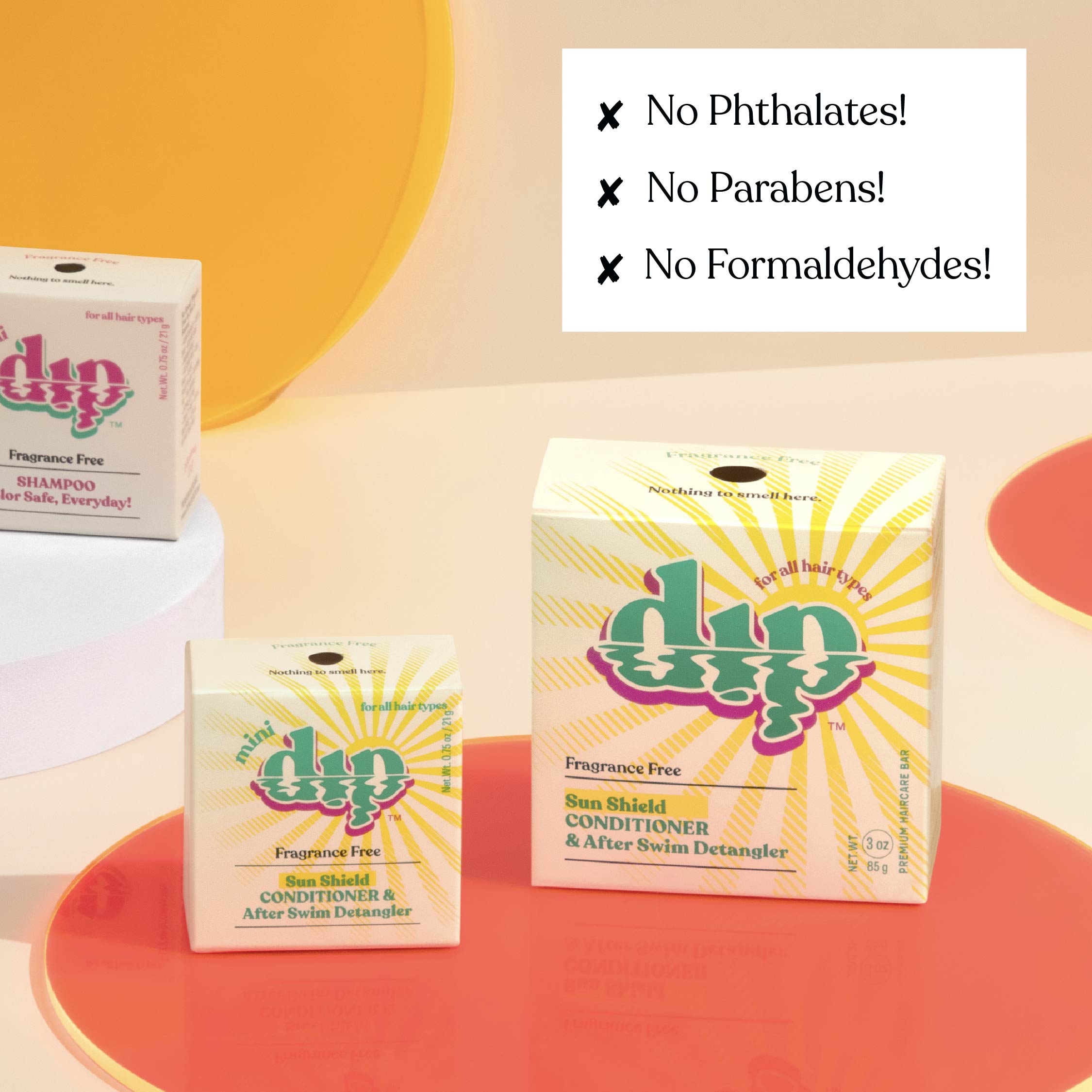 Dip hair care product boxes with safety claims on a colorful background