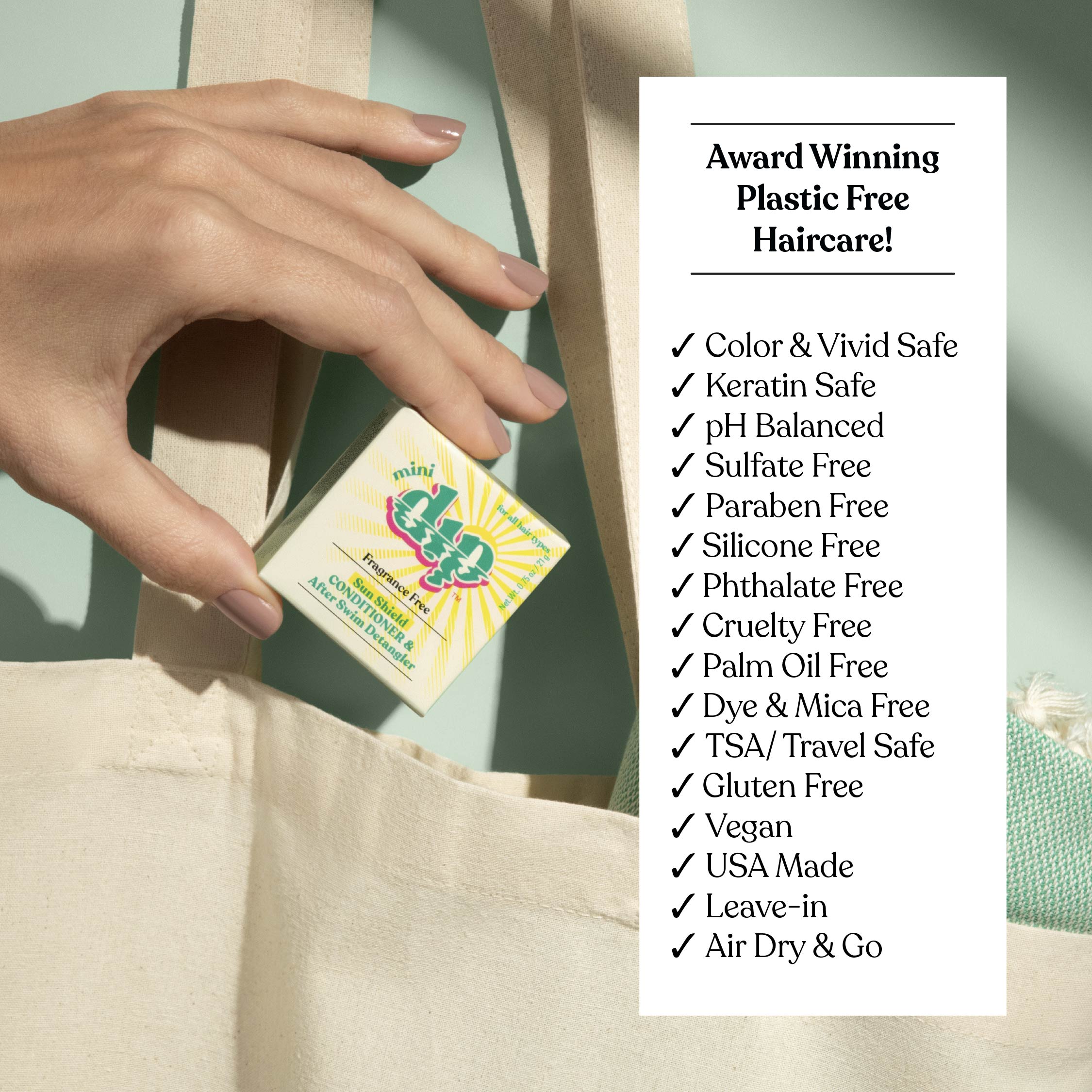 Hand holding a bar of soap with a list of product features on a beige background