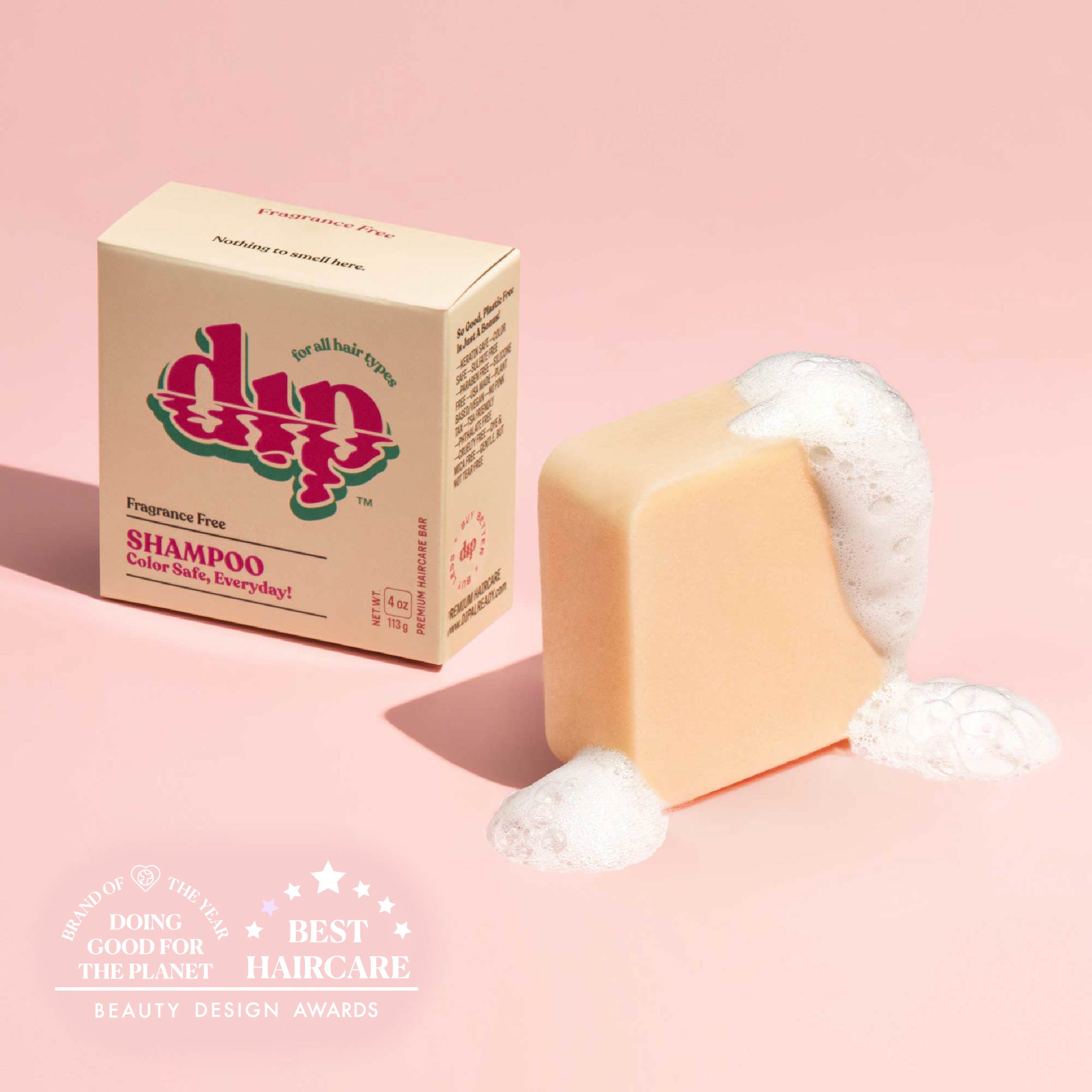 Bar of soap with a box labeled 'dup' on a pink background
