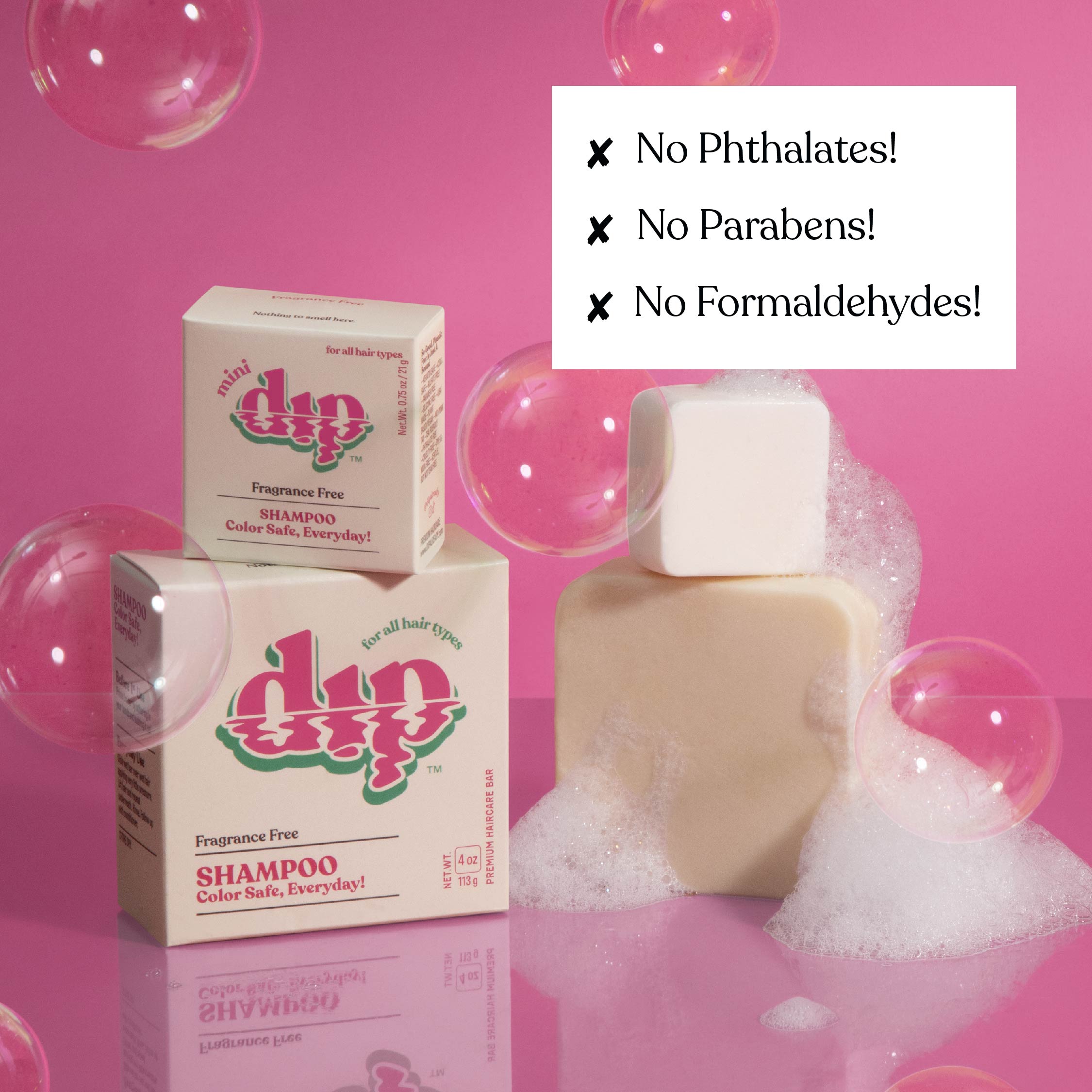 Dip shampoo and soap with bubbles on a pink background, featuring text about chemical-free ingredients.