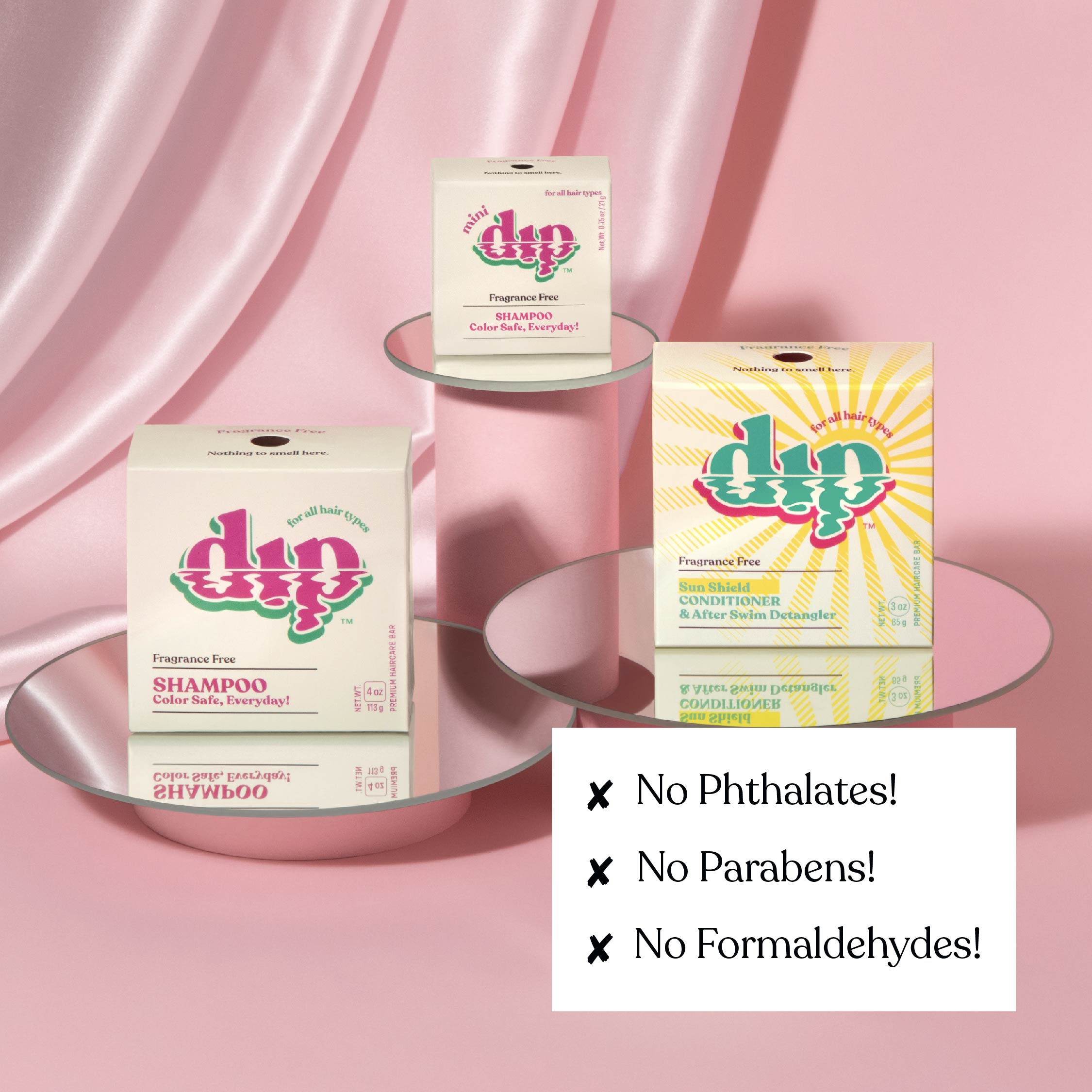 Dip hair care product boxes on a pink background with 'No Phthalates!', 'No Parabens!', and 'No Formaldehydes!' text.