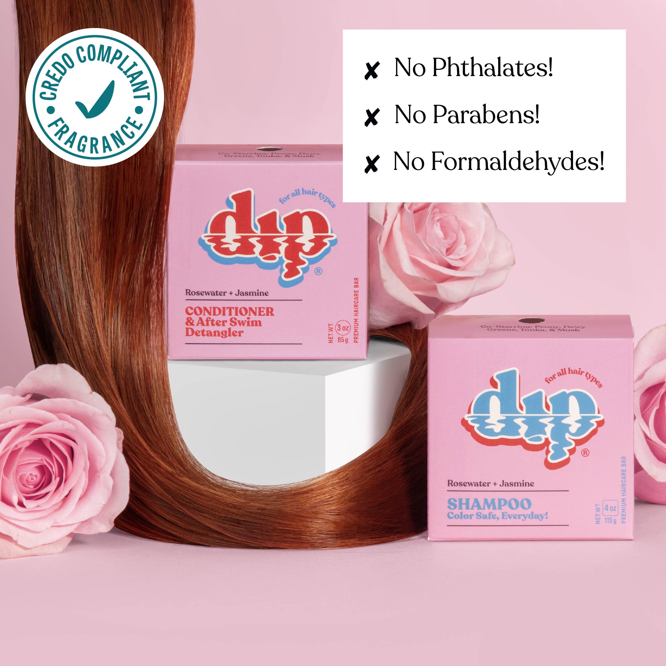 Dip shampoo and conditioner boxes with a bowl of hair and pink roses on a pink background.