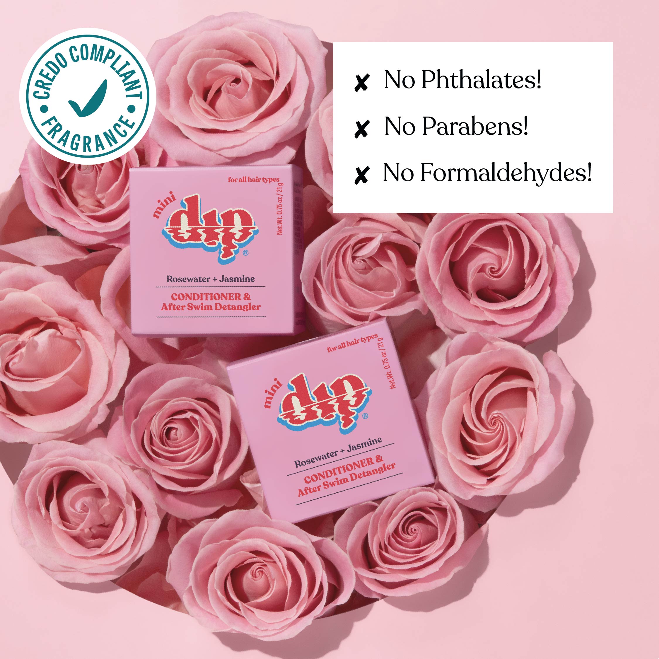 Two boxes of 'dip' products surrounded by pink roses on a pink background with greenery.