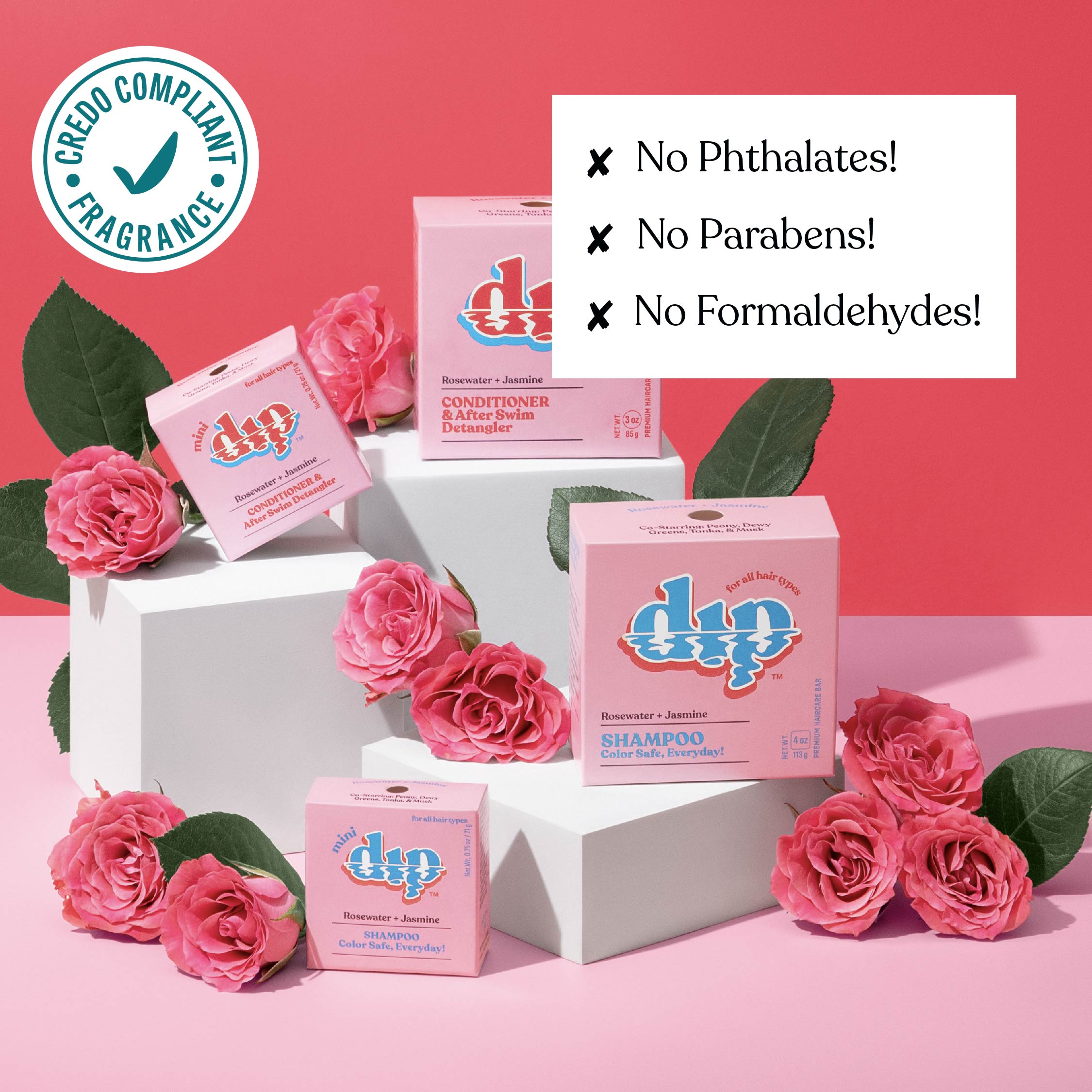 Dip hair care products with pink roses on a pink background, featuring GECO compliant fragrance label.