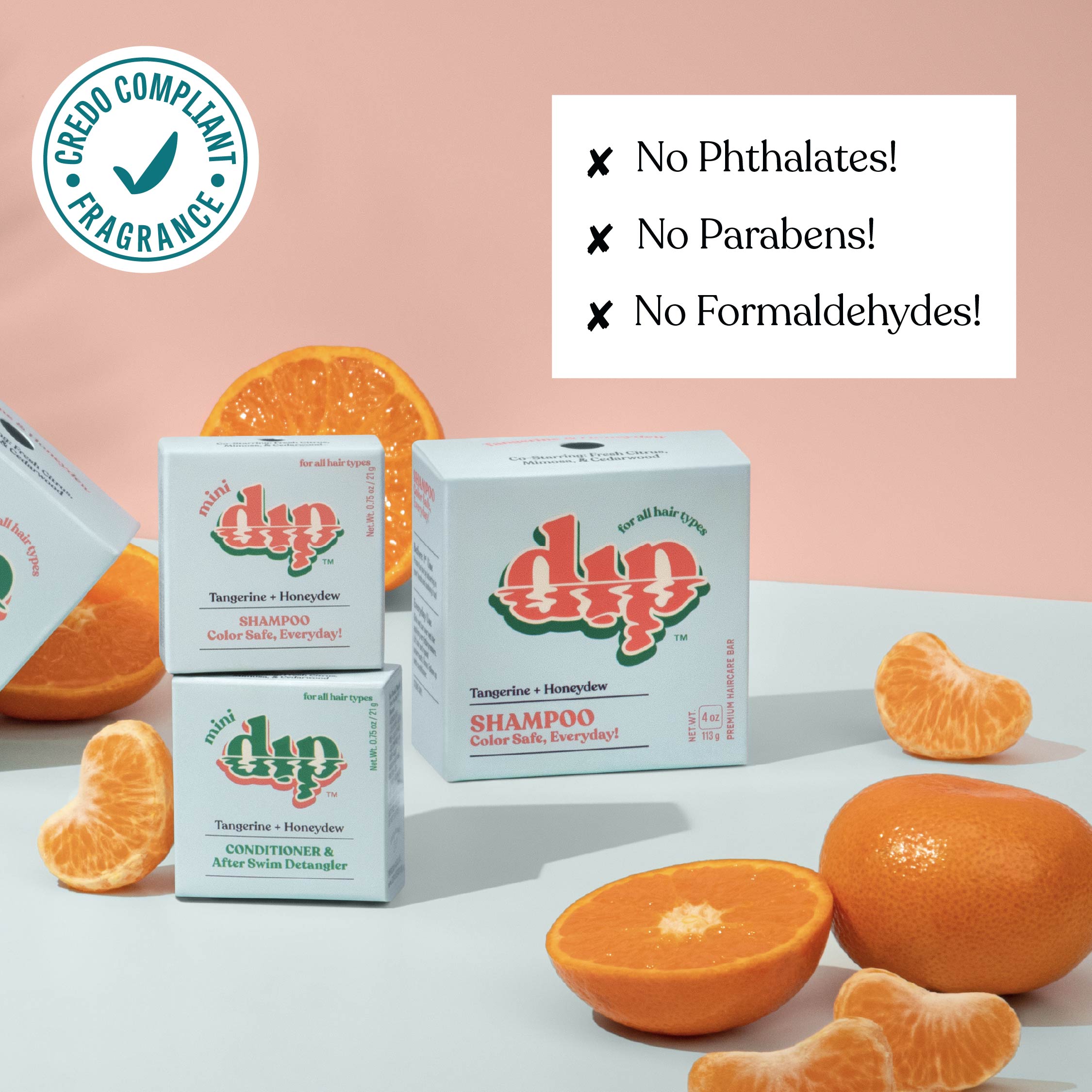 Dip shampoo boxes with oranges on a light background, featuring greenery compliance logo and safety claims.
