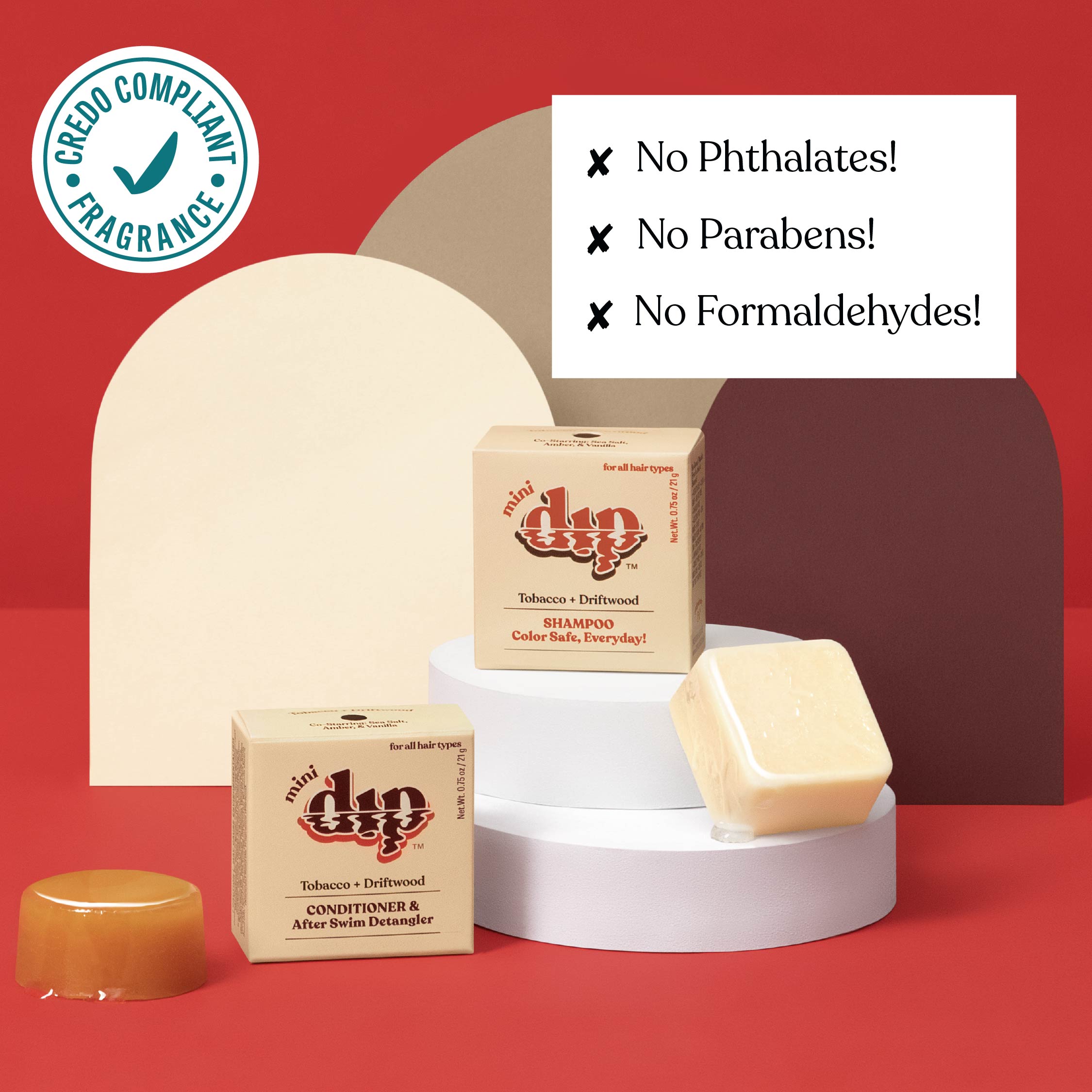 Duo shampoo and conditioner bars with a soap bar on a red background, featuring greenery compliance badge.