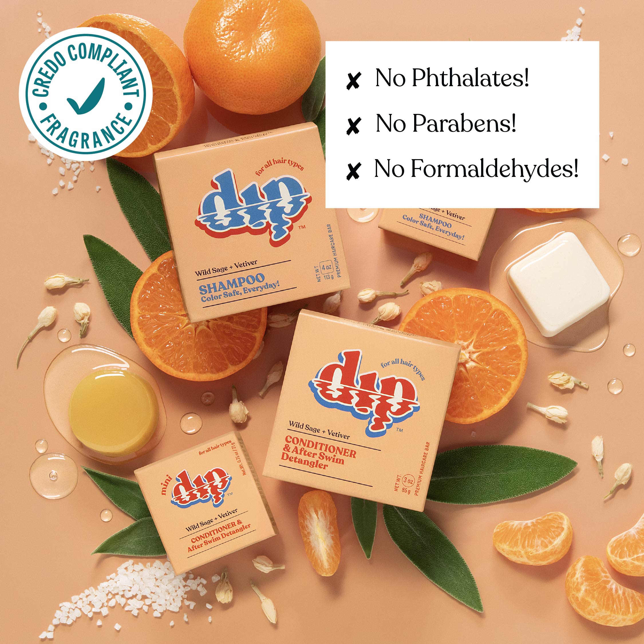 Dip shampoo and conditioner bars with oranges and leaves on a beige background
