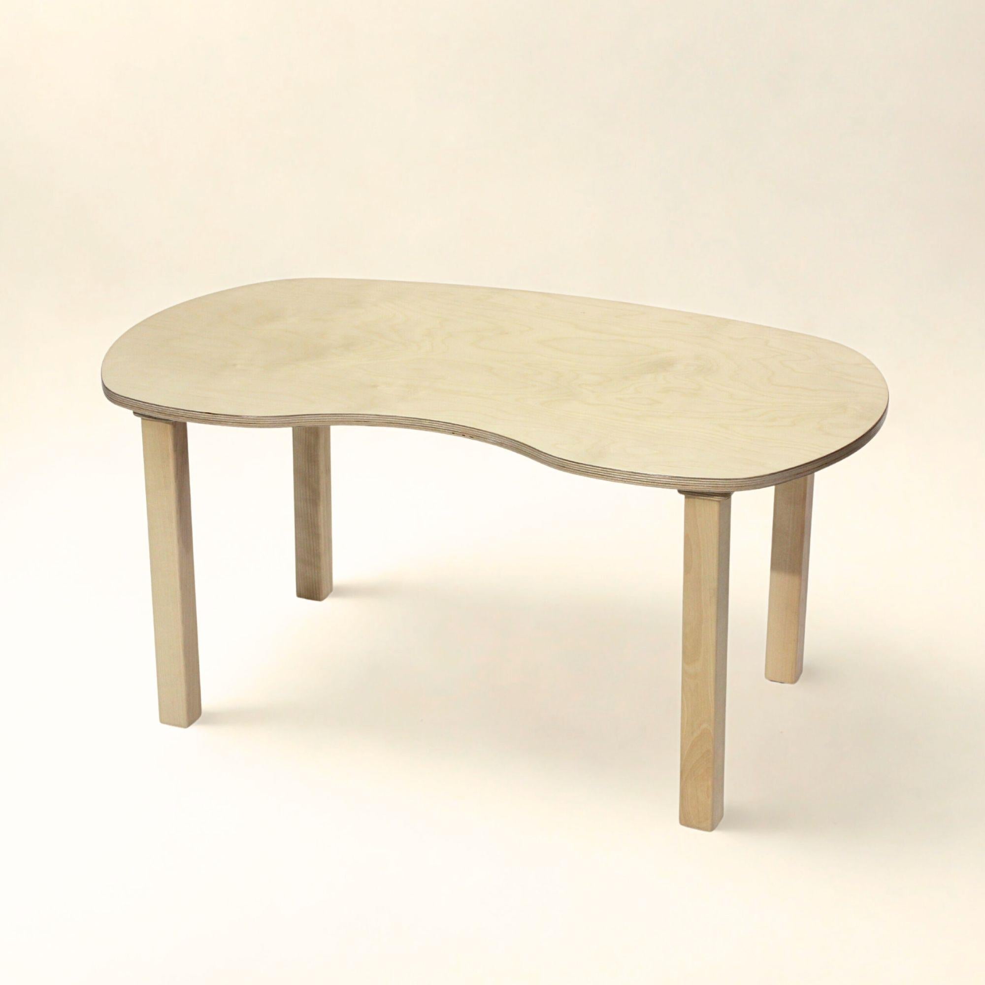 Wooden coffee table with a curved design on a beige background