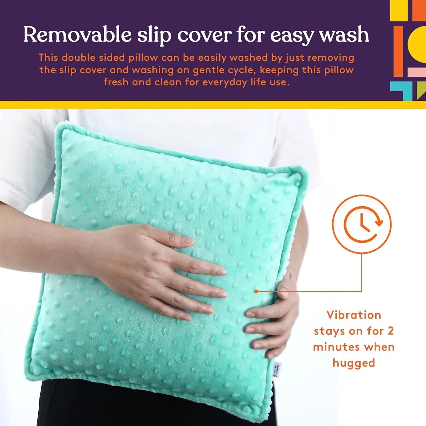 Person holding a blue sensory pillow with removable cover and vibration feature