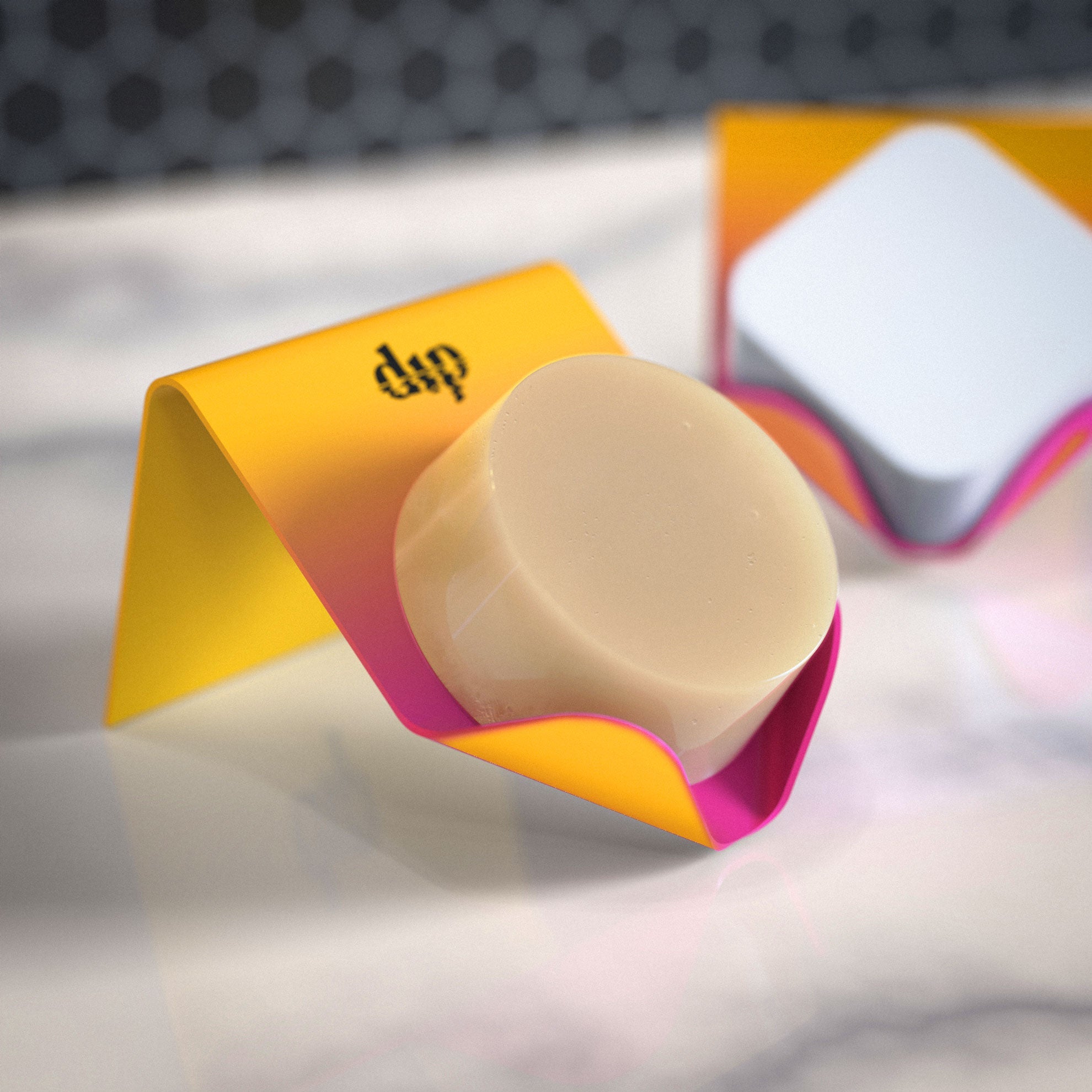 Round beige object with a colorful stand on a blurred background