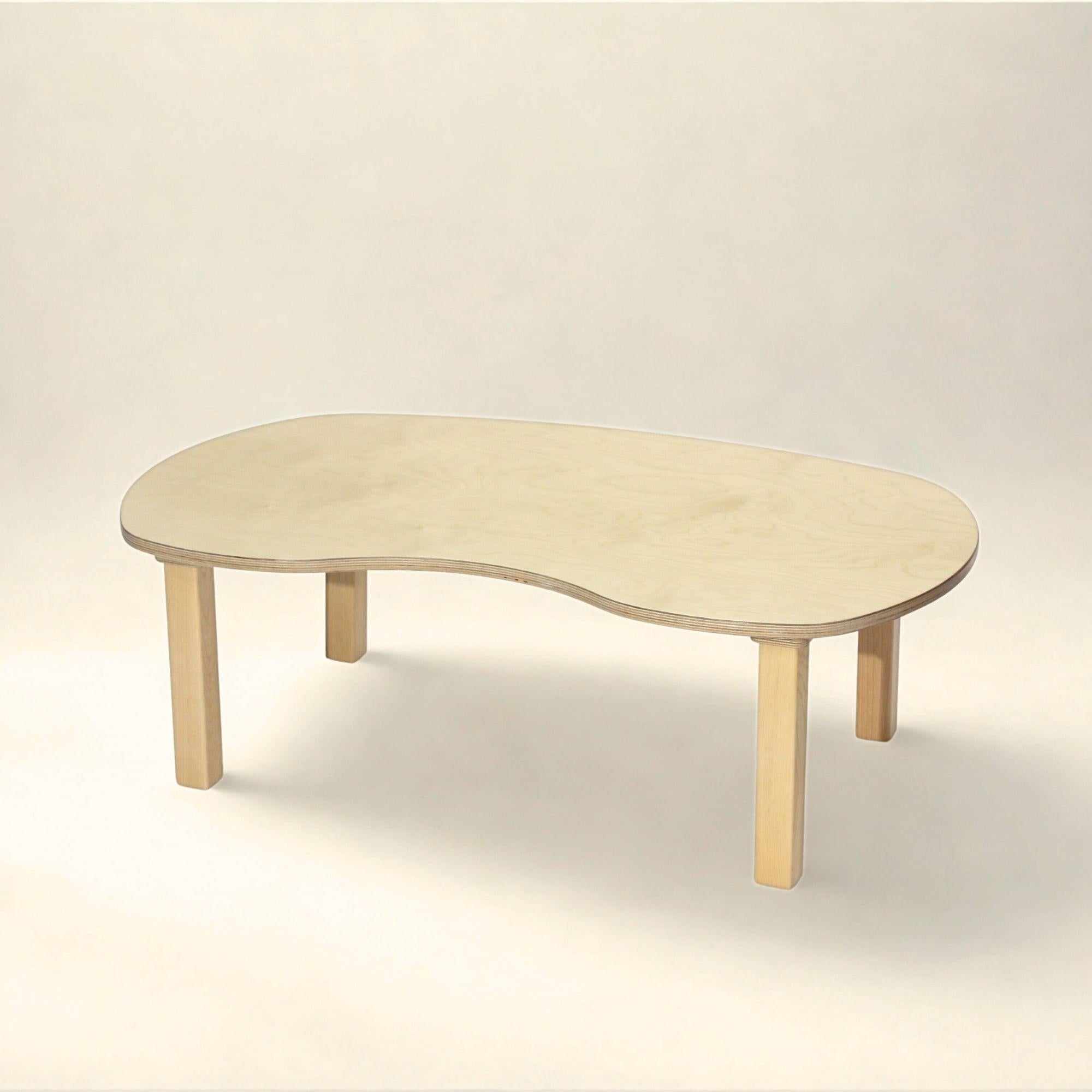 Wooden coffee table on a light beige background