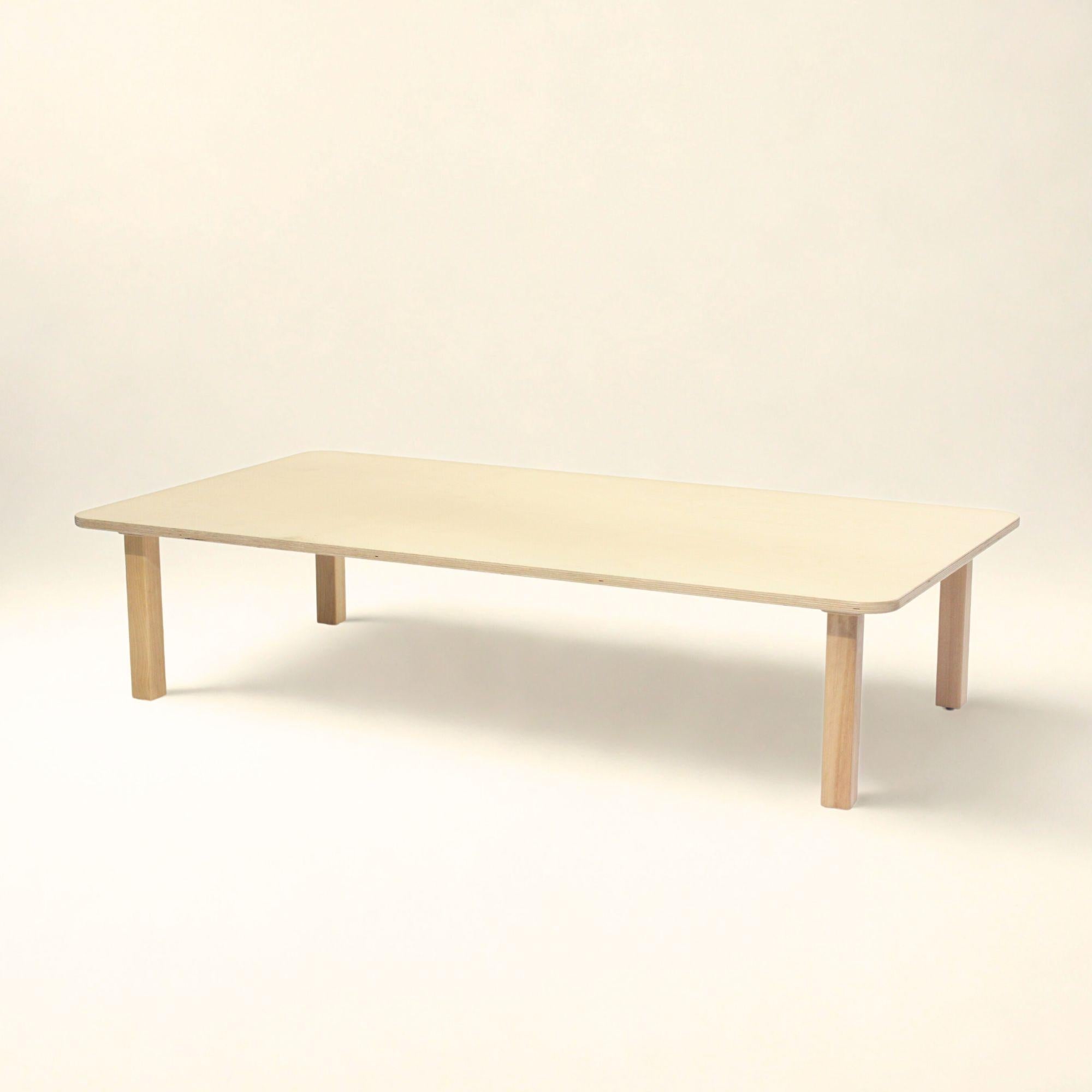 Light wood coffee table on a white background