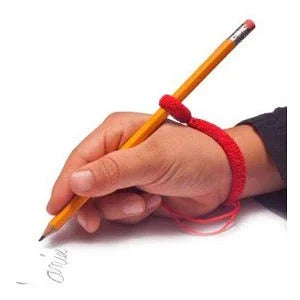 Handwriting with pencil using red sensory grip, handwriting aid for kids with learning differences.