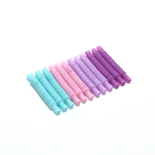 Set of colorful sensory fidget pop tubes in blue, pink, purple on white background