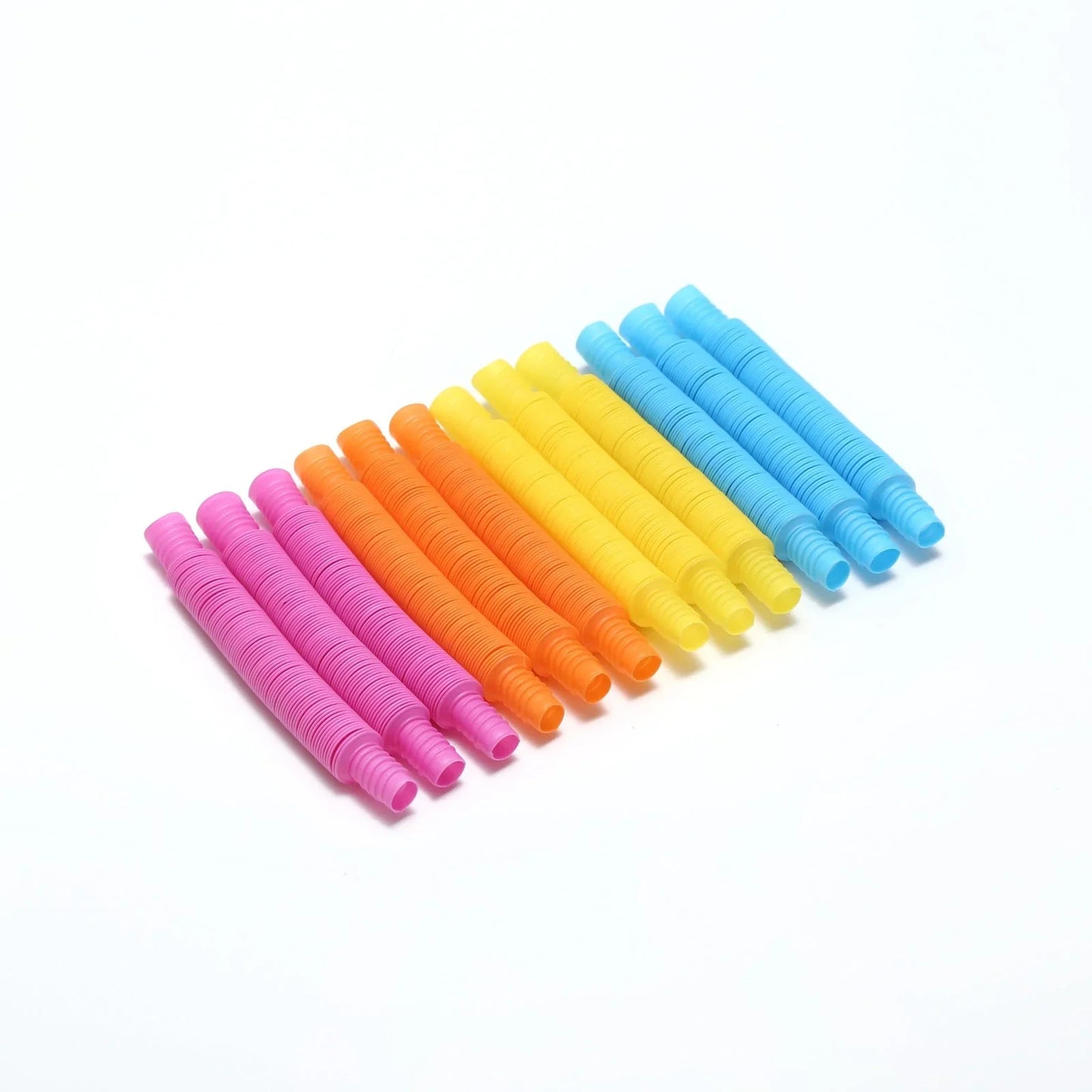 Colorful sensory fidget pop tubes for kids, arranged in a row on white background