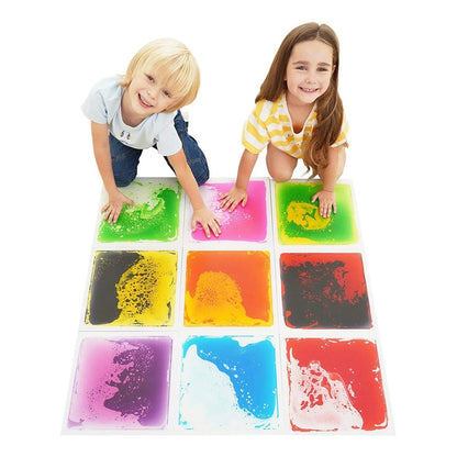 Children playing on sensory liquid floor tiles in bright colors, sensory learning activity