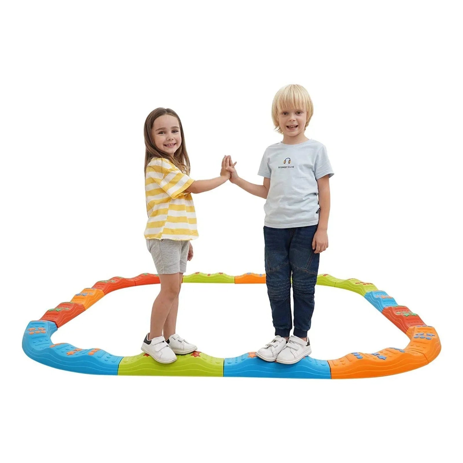 Two children play on a colorful sensory balance beam, promoting motor and sensory skills.
