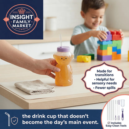 Spill-proof sensory drink cup with bear design and straw, child playing with blocks in background.