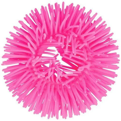 Pink sensory puffer bracelet ring with soft rubbery spikes for tactile stimulation