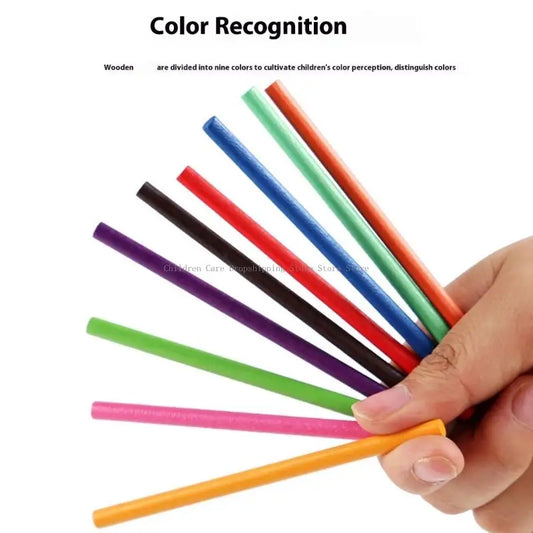Hand holding colorful wooden sticks with text about color recognition.