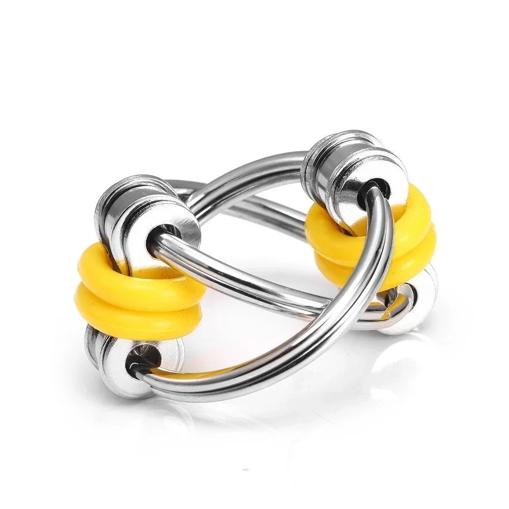 Silver fidget toy with yellow silicone rings, sensory tool for focus and stress relief