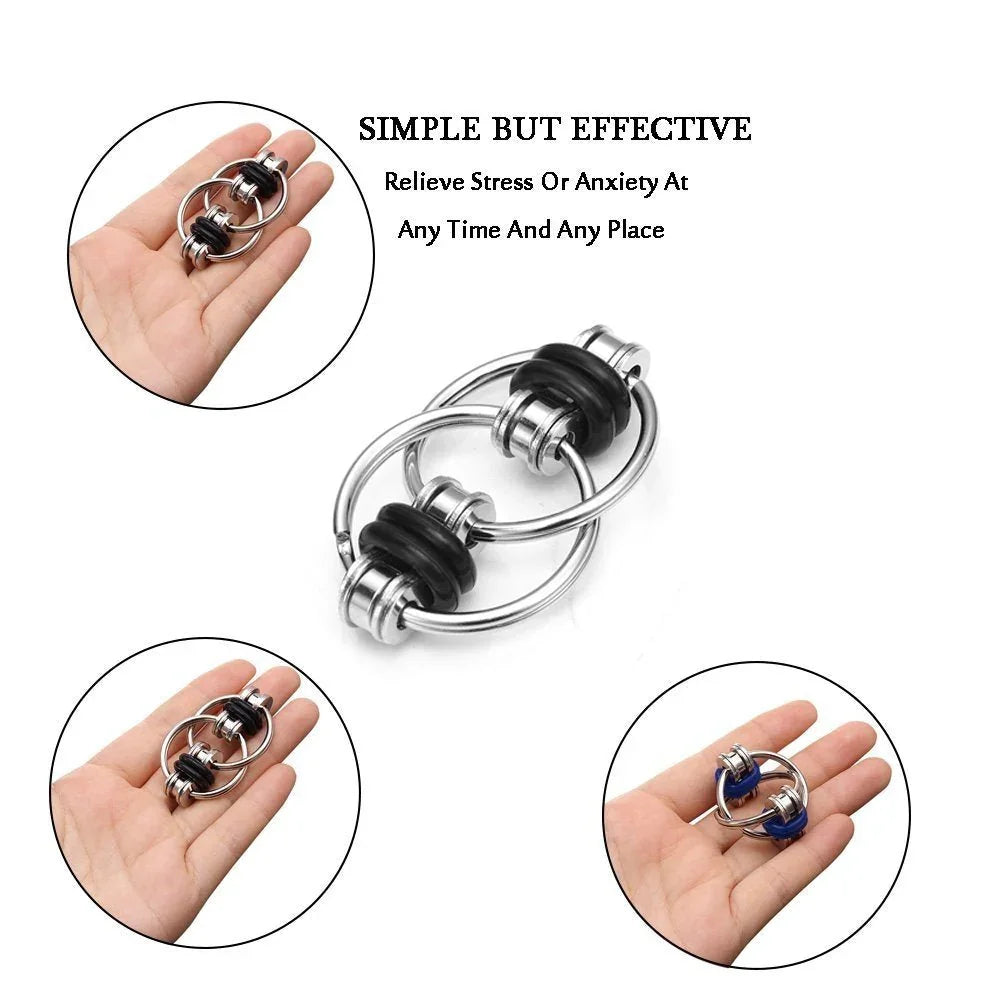 Hand holding metal fidget toy with black rings, ideal for sensory stress relief and focus support.