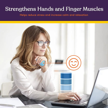 Woman using blue hand therapy stress ball at desk for finger and hand muscle exercise