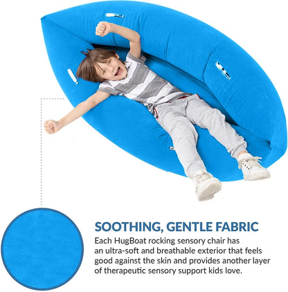 Child smiling while sitting in a blue sensory rocking chair, ideal for sensory support.