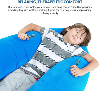Child relaxing in a blue inflatable sensory compression chair for calming therapy
