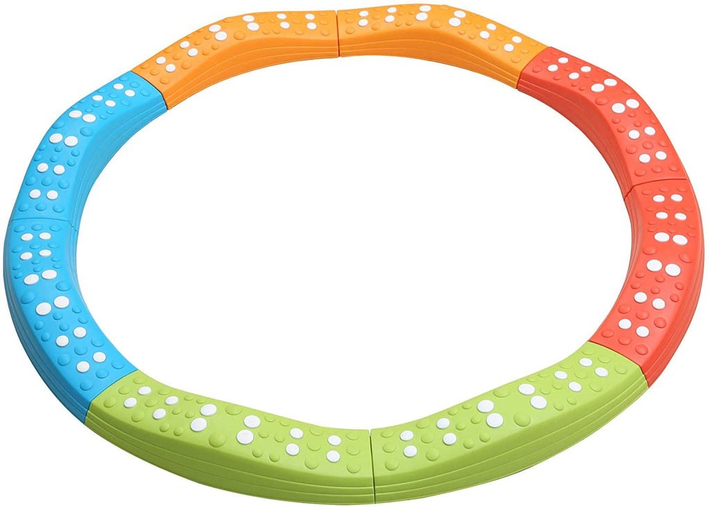 Colorful plastic ring toy with white dots on a white background