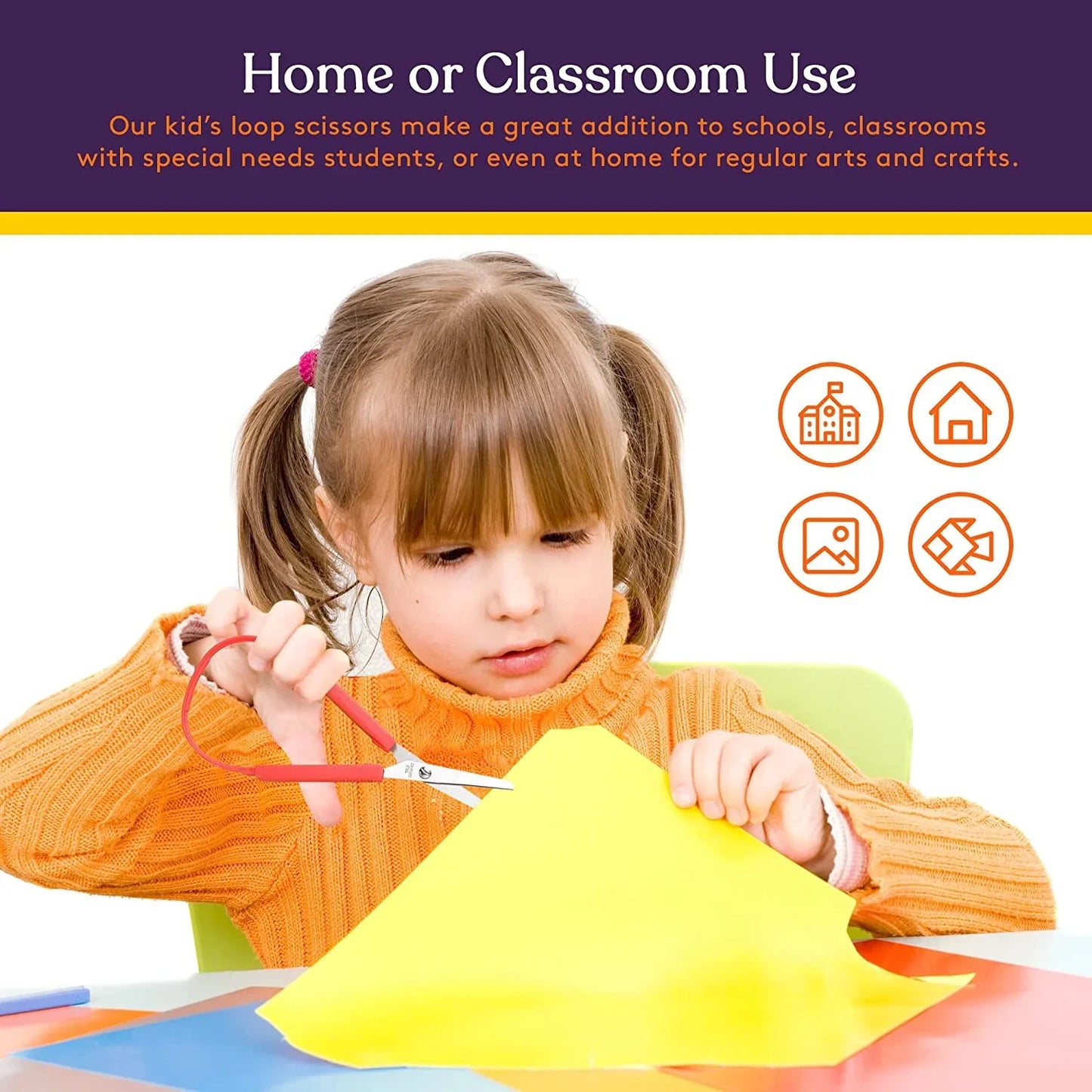 Young child using adaptive loop scissors to cut yellow paper for arts and crafts