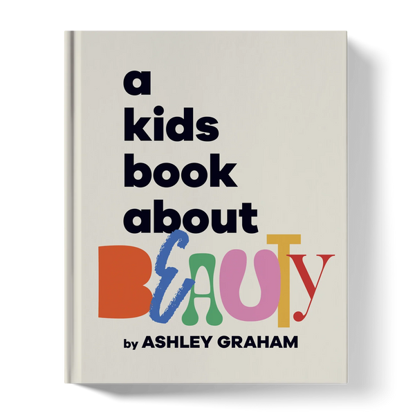 A children’s book titled 'a kids book about BEAUTY' with colorful, bold lettering on the cover.