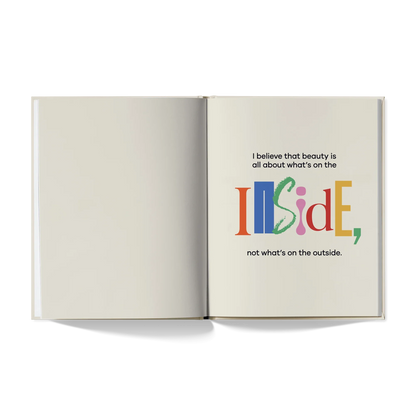 Open book with colorful quote, 'I believe that beauty is all about what’s on the inside'.