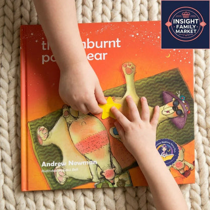 Child's hands playing with star on sensory-friendly children's book on cozy rug
